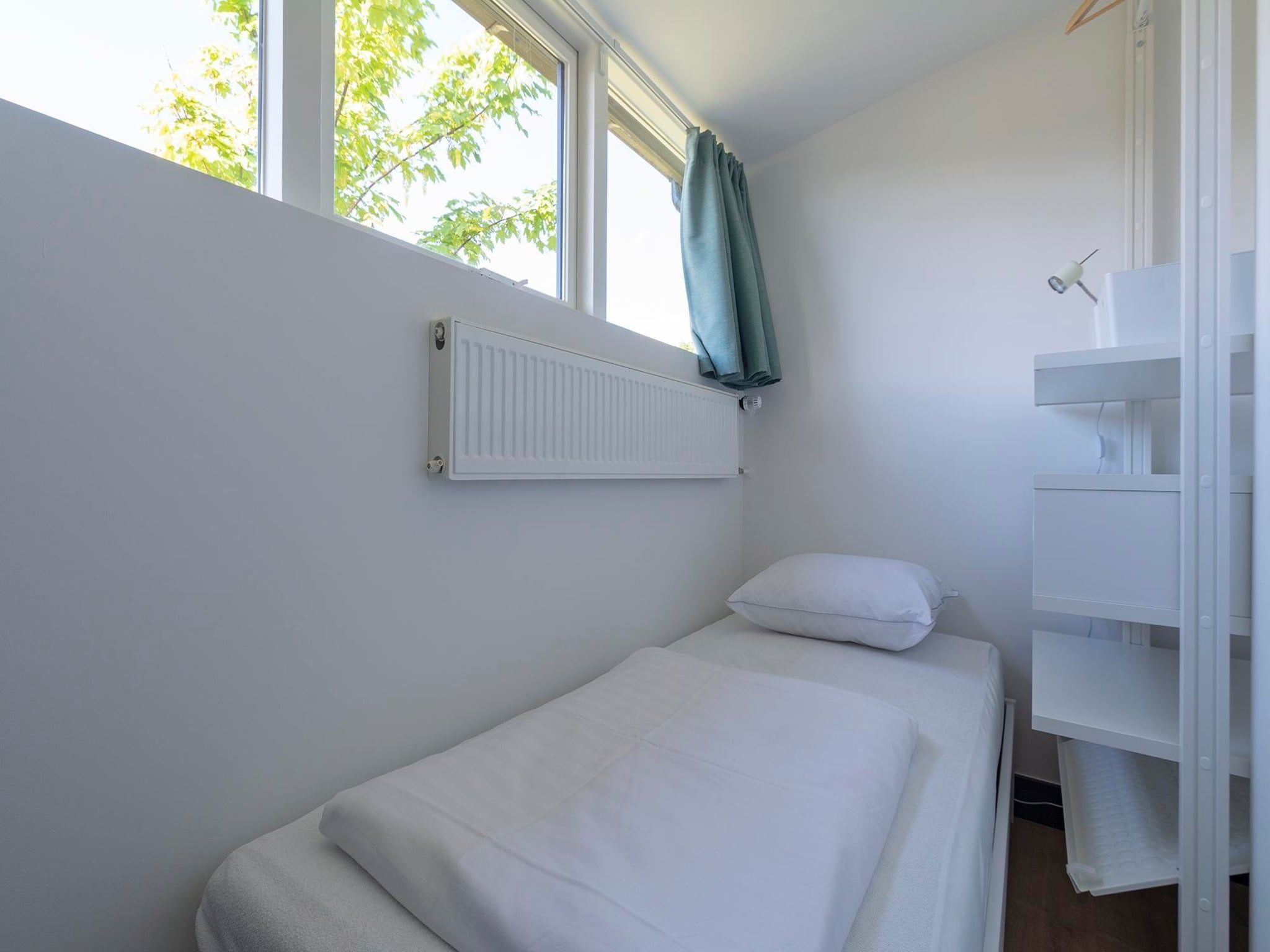 Een slaapkamer van Previnaireweg 34 in Callantsoog
