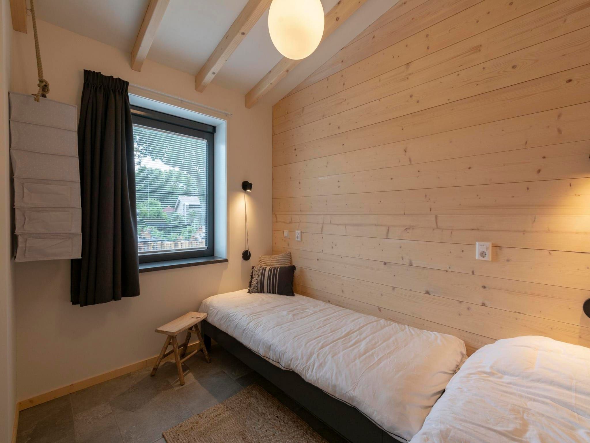 Een slaapkamer van Previnaireweg 5 in Callantsoog