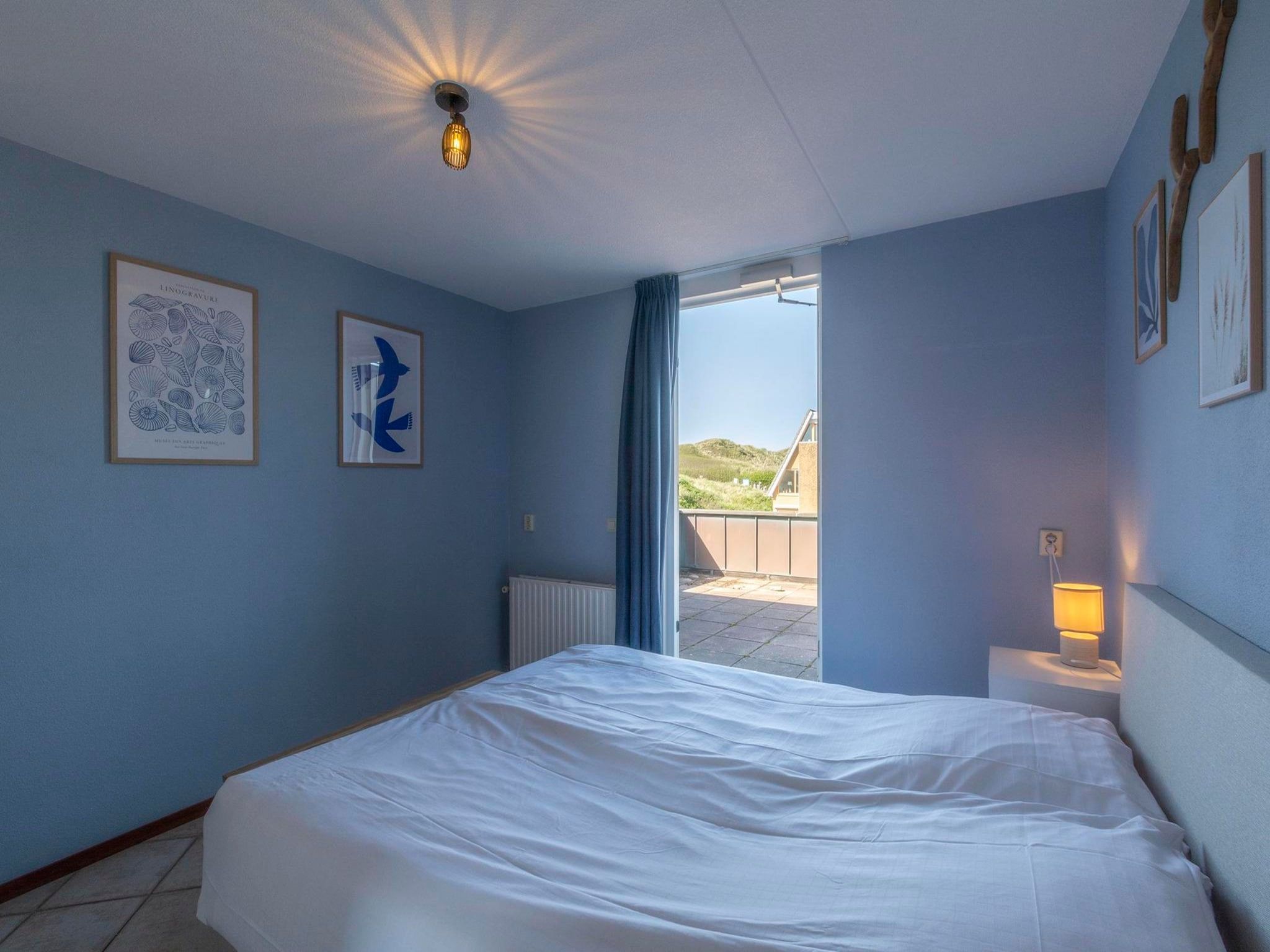 Een slaapkamer van Wijde Blick 311 in Callantsoog