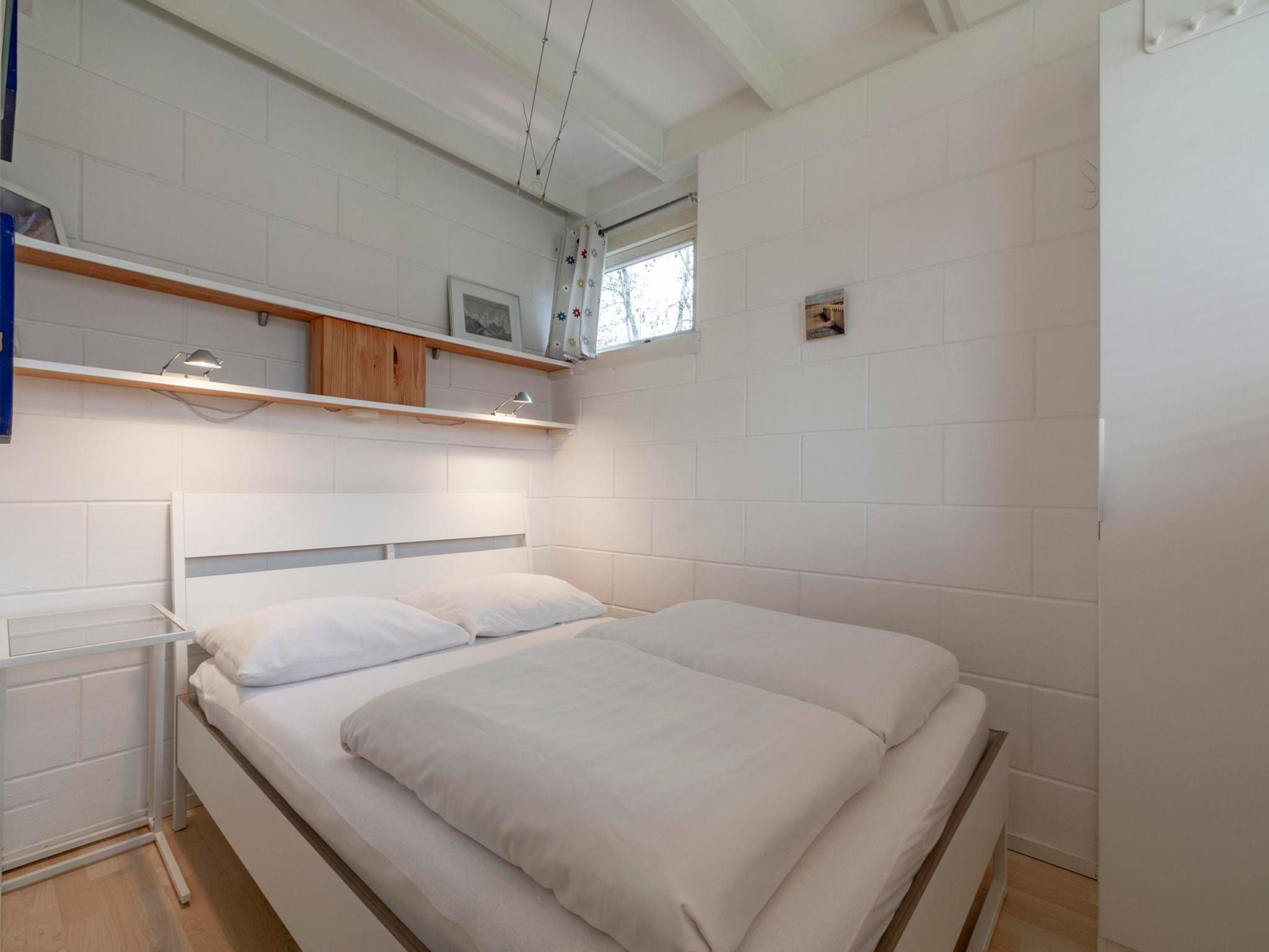 Een slaapkamer van Wildrijk 83 in Sint Maartenszee