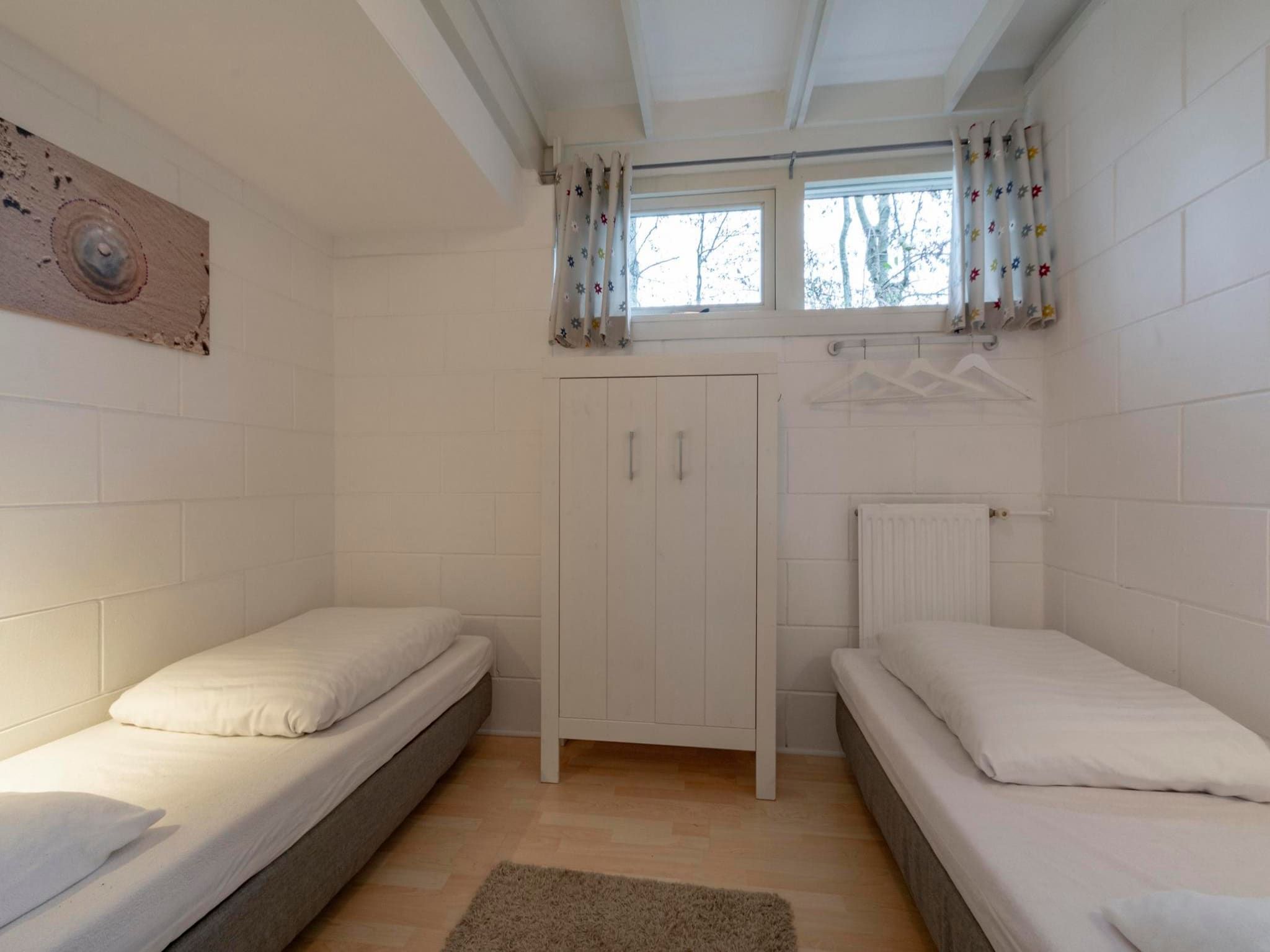 Een slaapkamer van Wildrijk 83 in Sint Maartenszee