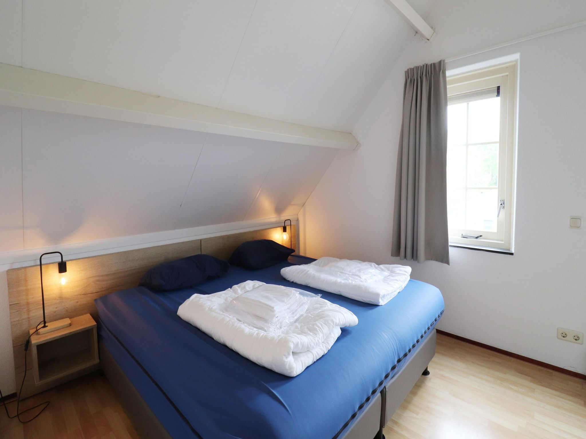 Een slaapkamer van Villapark Zuytland Buiten 24 in Simonshaven