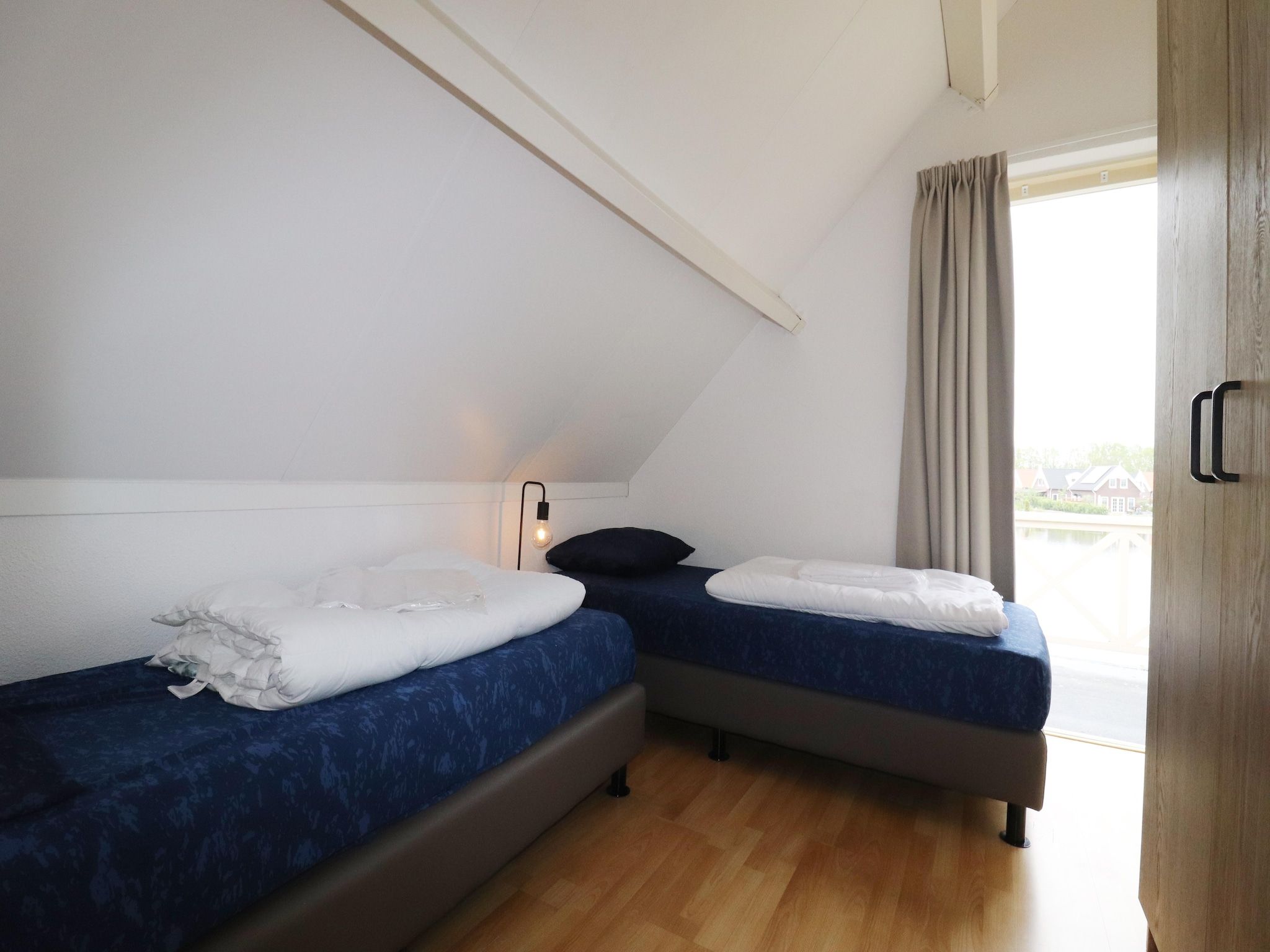 Een slaapkamer van Villapark Zuytland Buiten 24 in Simonshaven