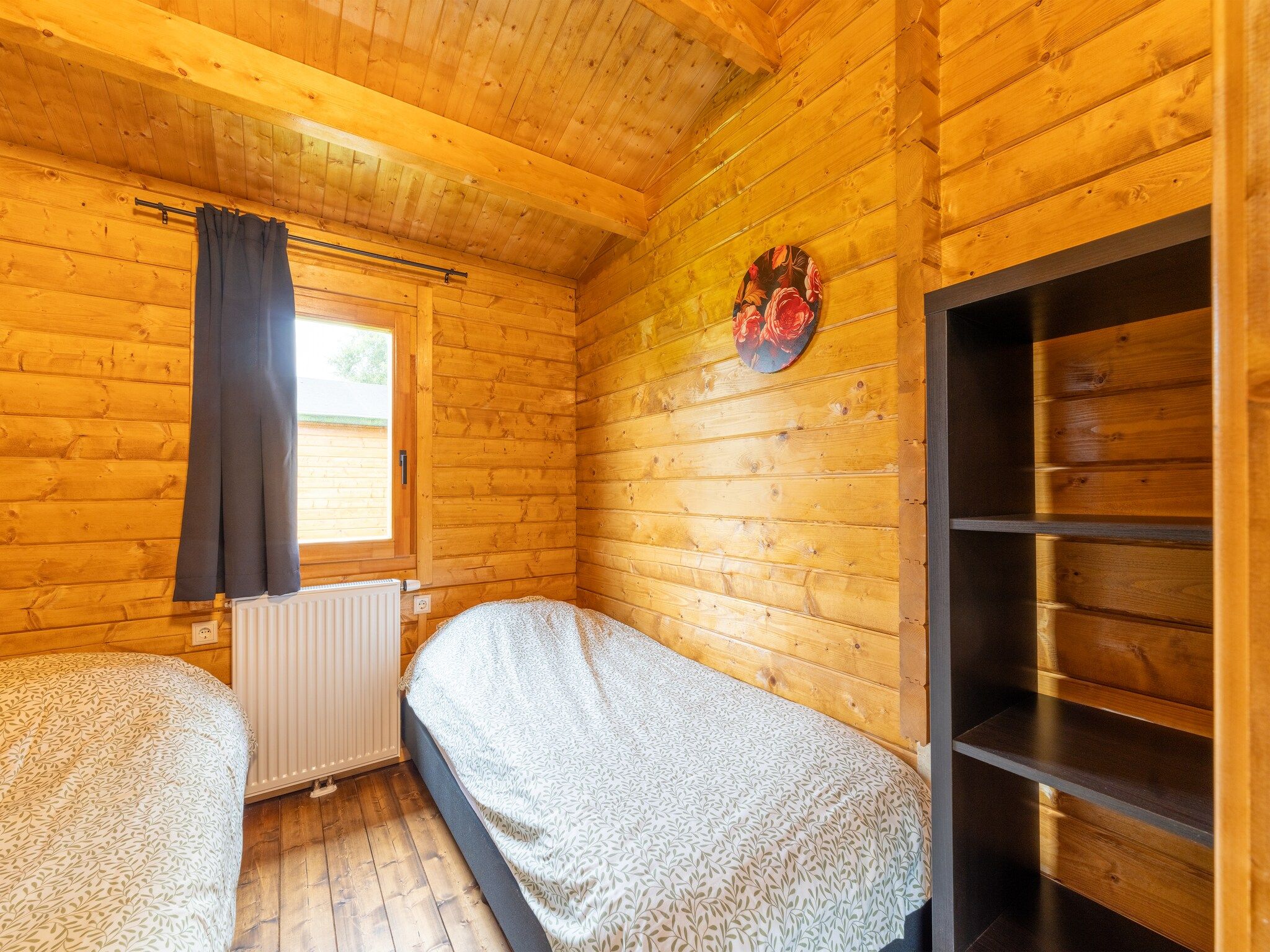 Een slaapkamer van Chalet Riga in Valkenswaard