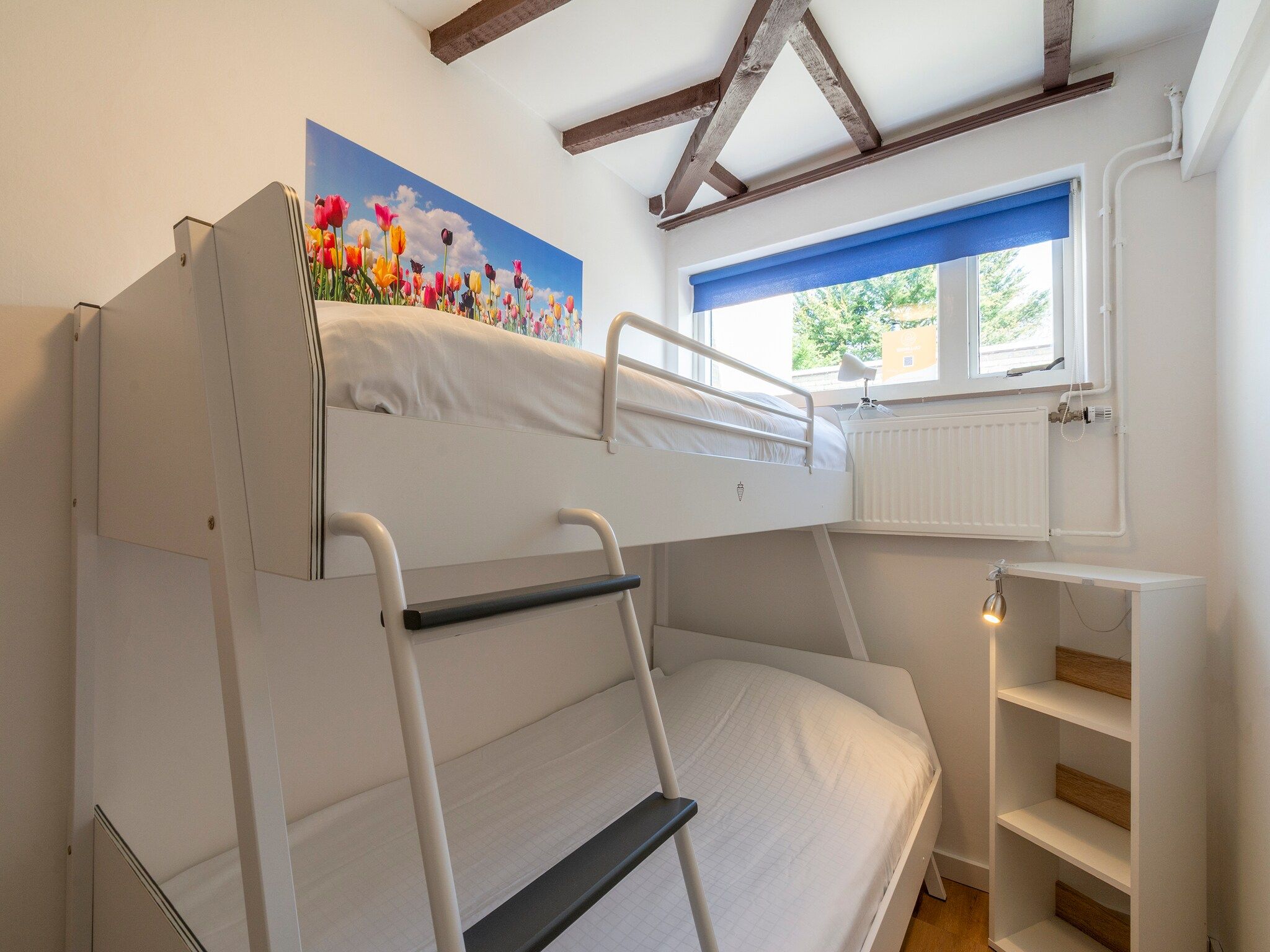 Een slaapkamer van Duinland 135 in Sint Maartenszee