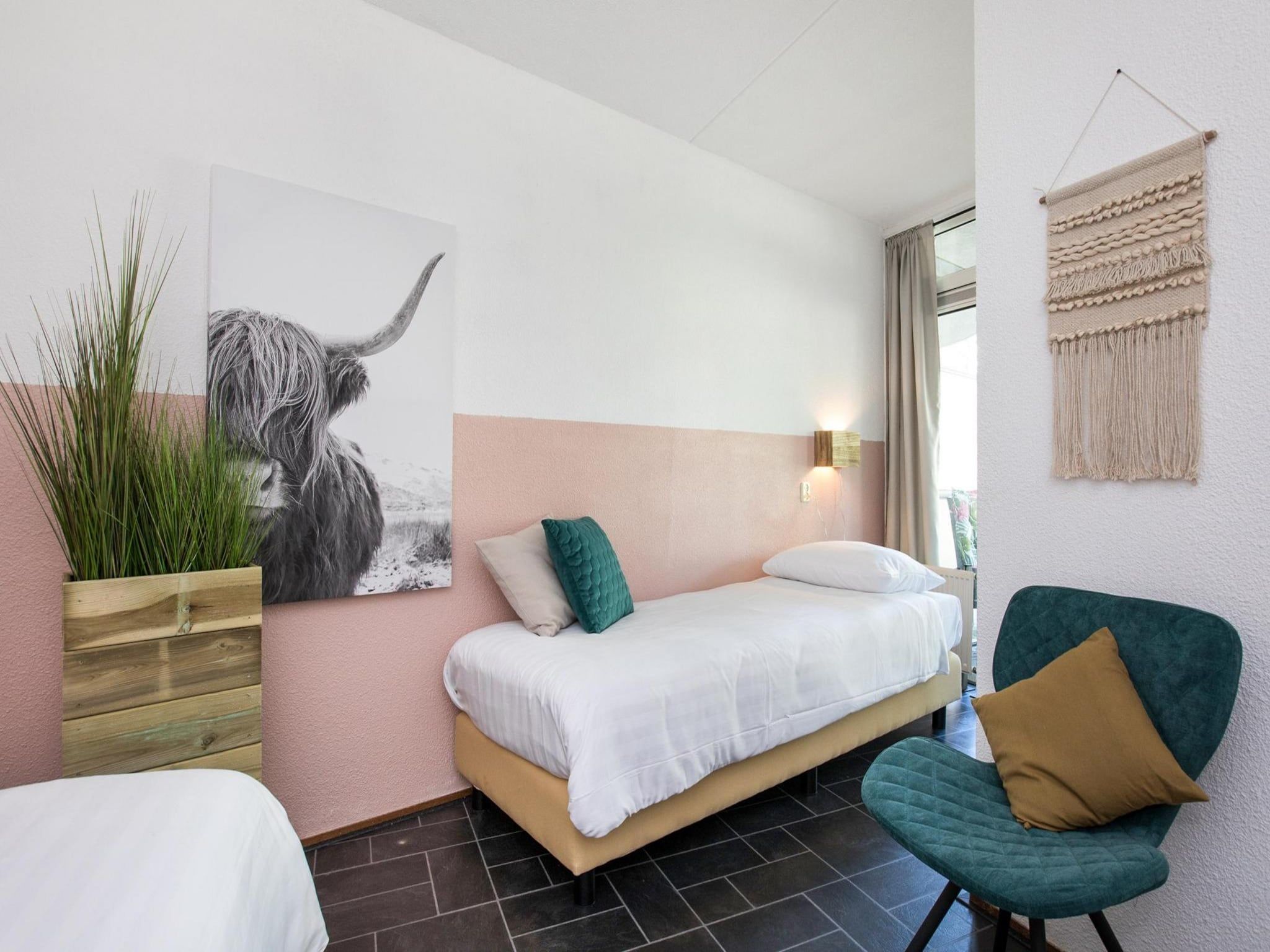 Een slaapkamer van Résidence Juliana 56 in Julianadorp aan Zee
