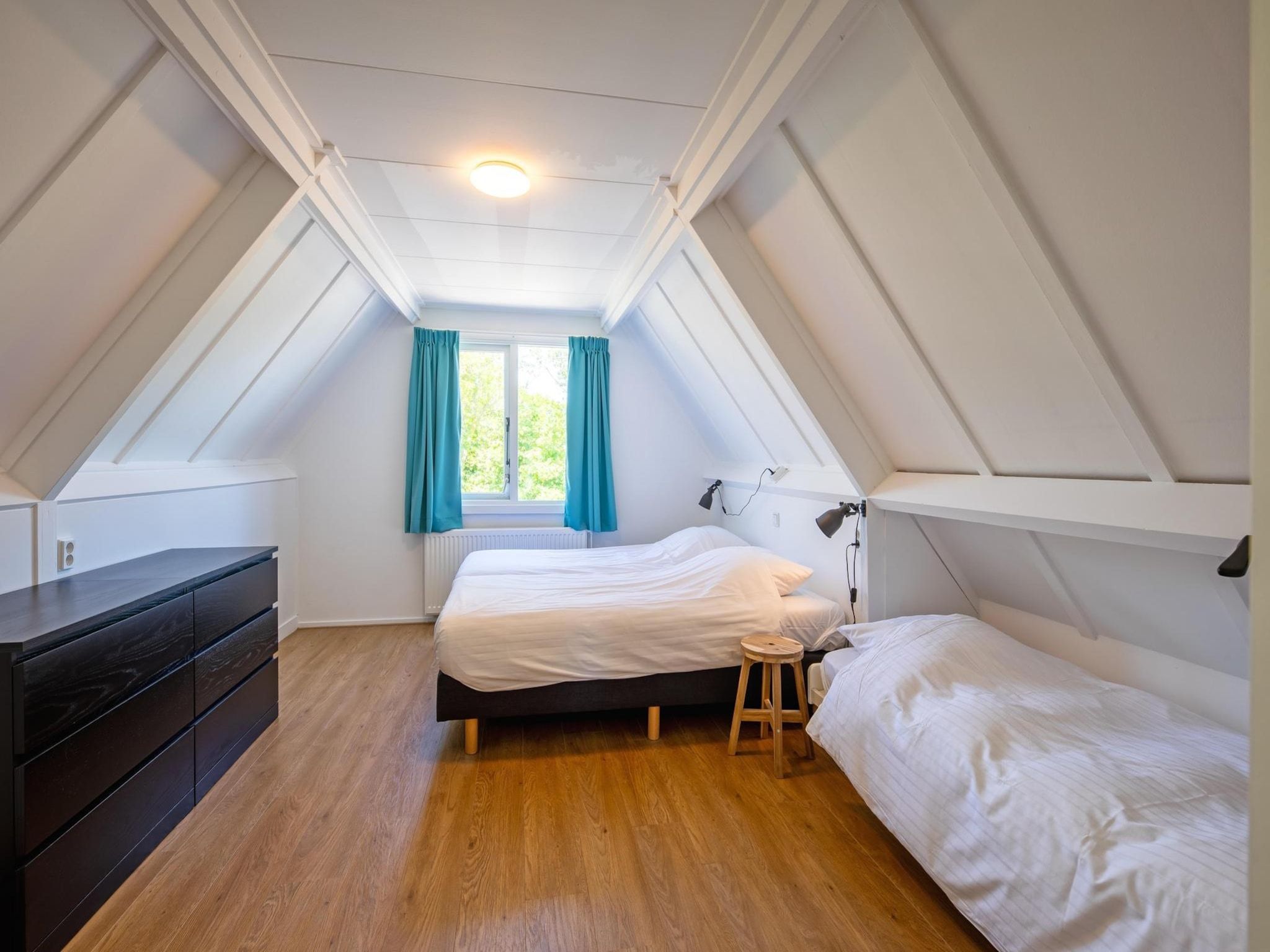 Een slaapkamer van Strandhuys Zeester in De Koog