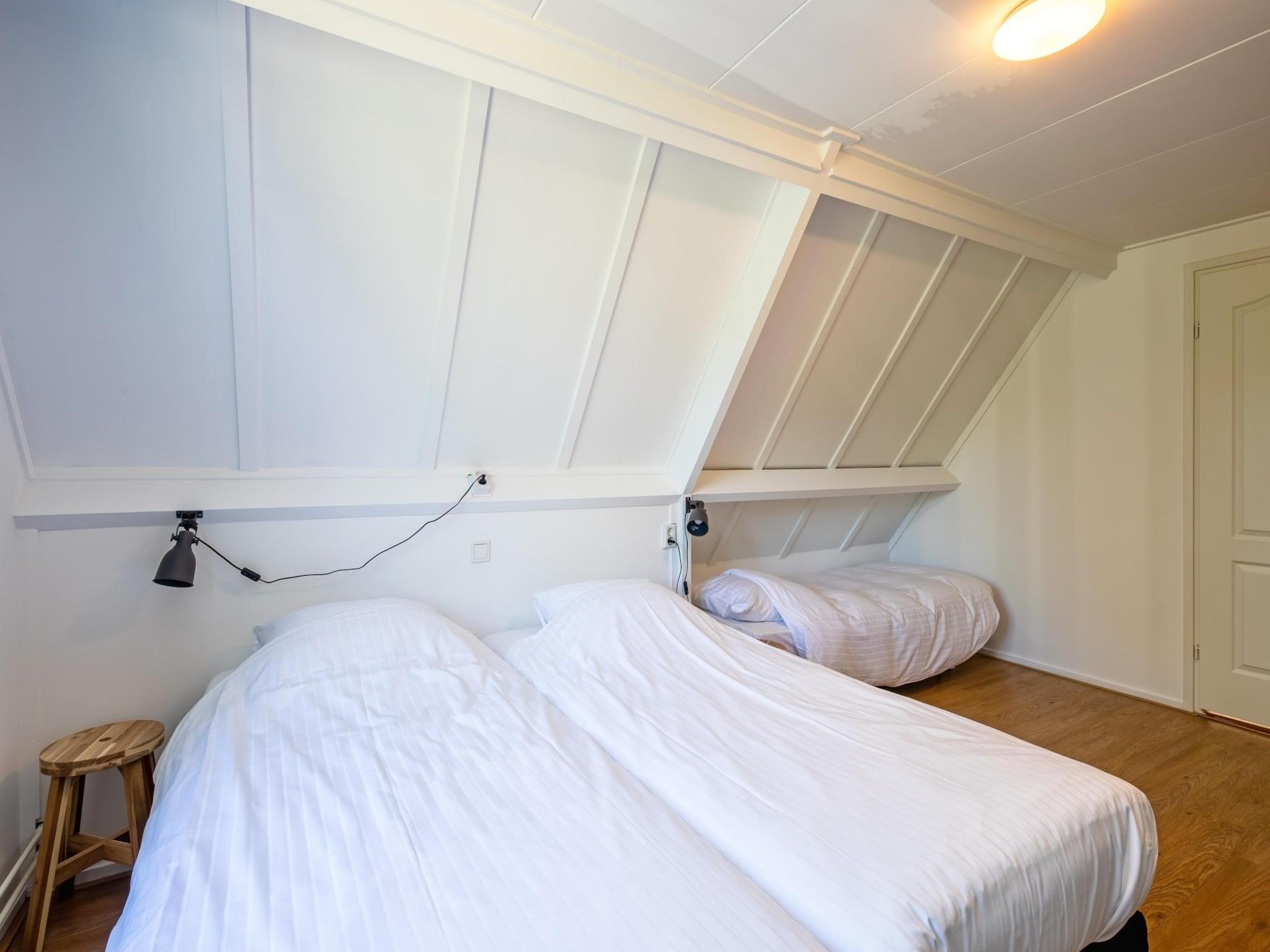 Een slaapkamer van Strandhuys Zeester in De Koog