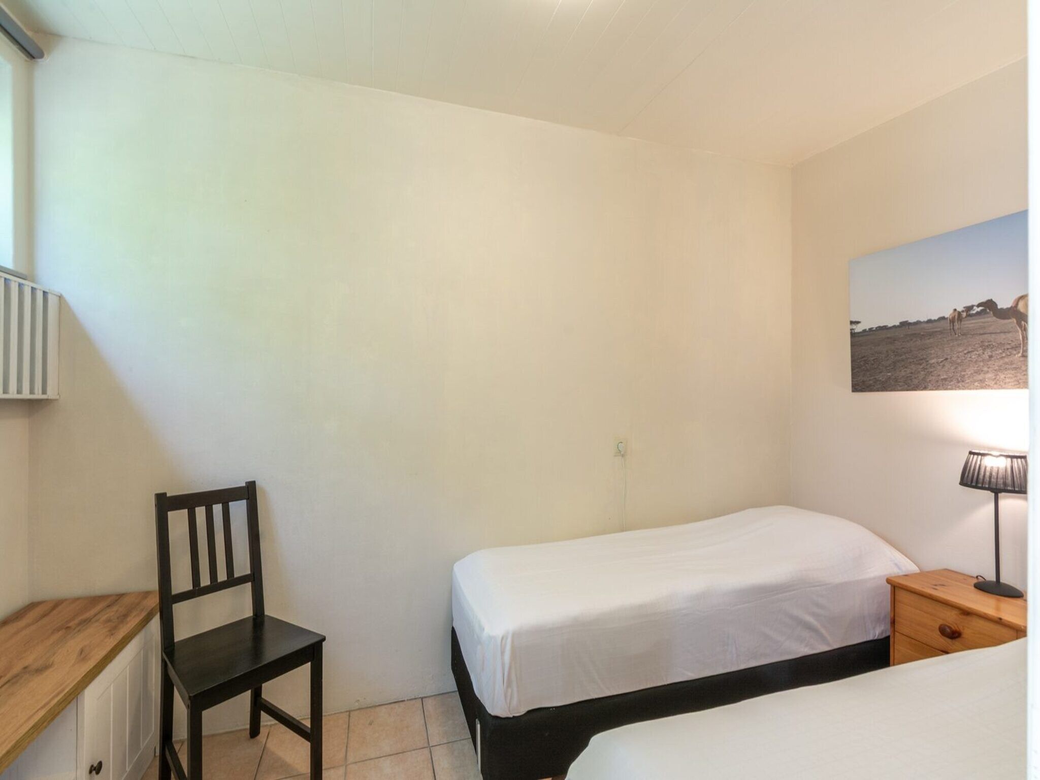 Een slaapkamer van Duinland 186 in Sint Maartenszee