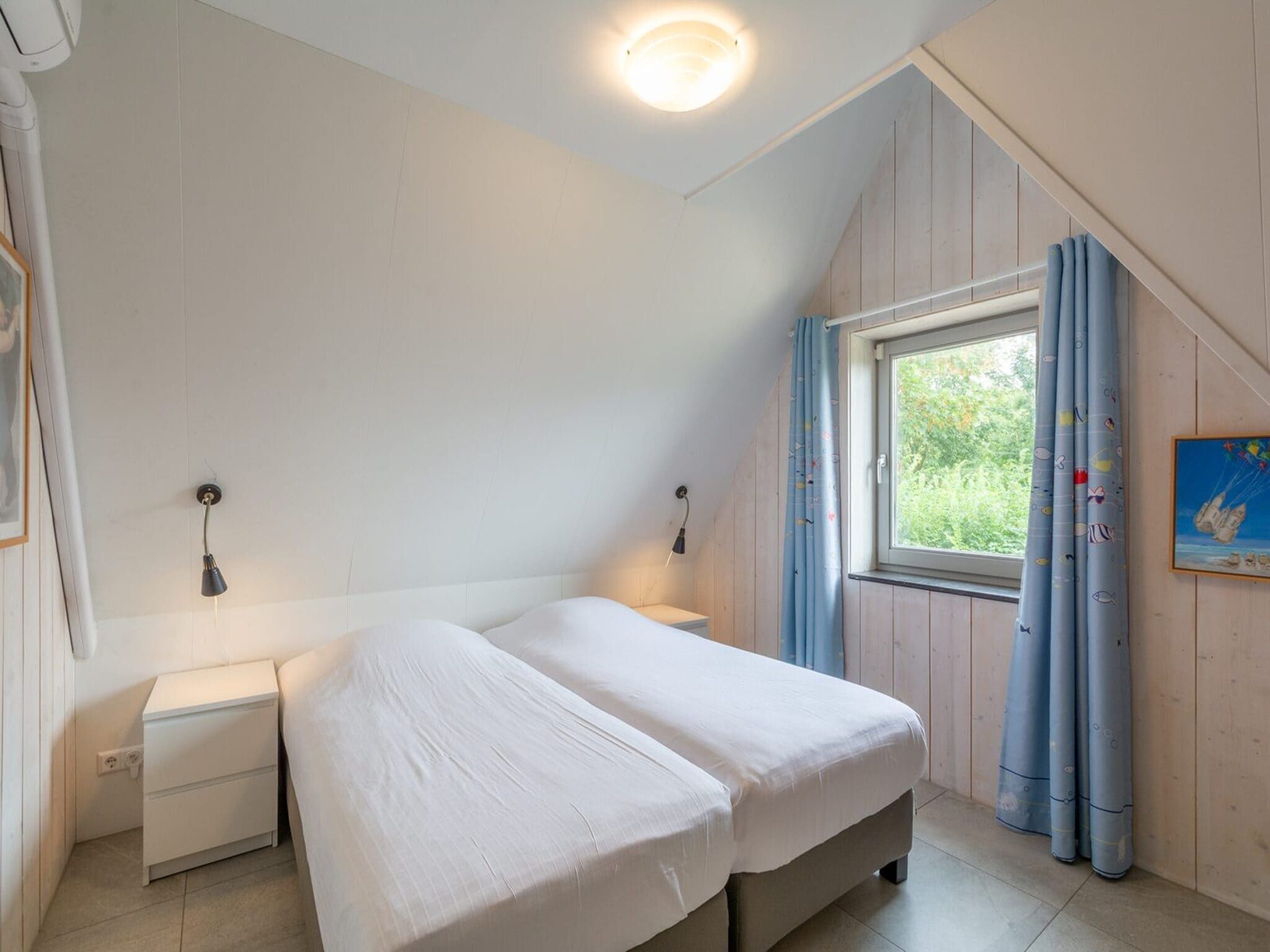 Een slaapkamer van Sandepark 171 in Callantsoog