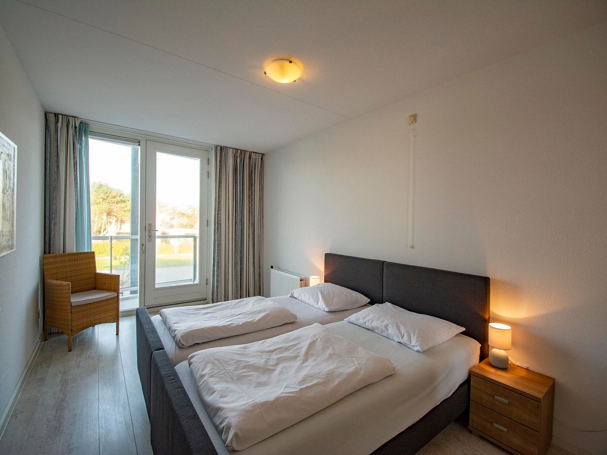 Een slaapkamer van Strandleven 103 in Groote Keeten