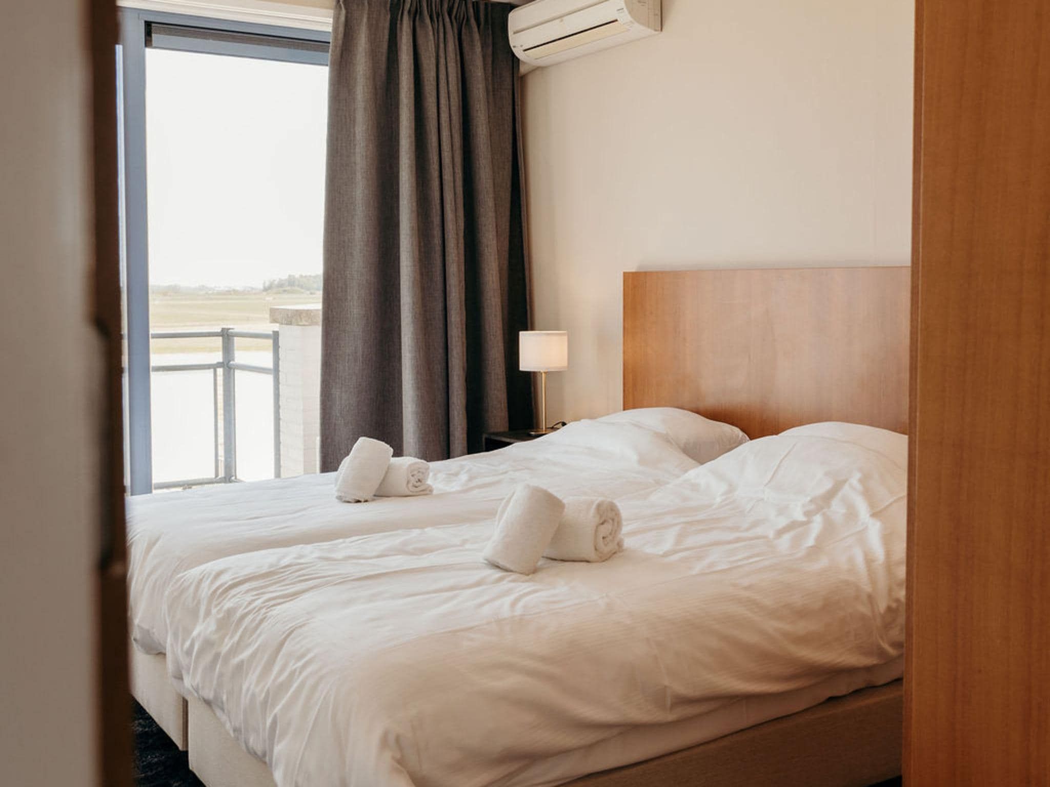 Een slaapkamer van De Vlijt - Business class in De Cocksdorp