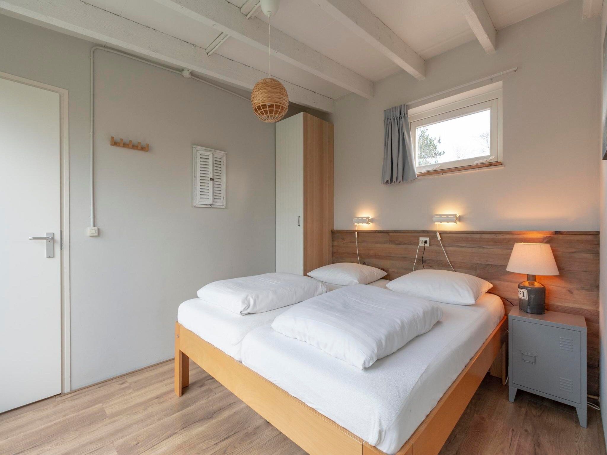 Een slaapkamer van Duinland 247 in Sint Maartenszee