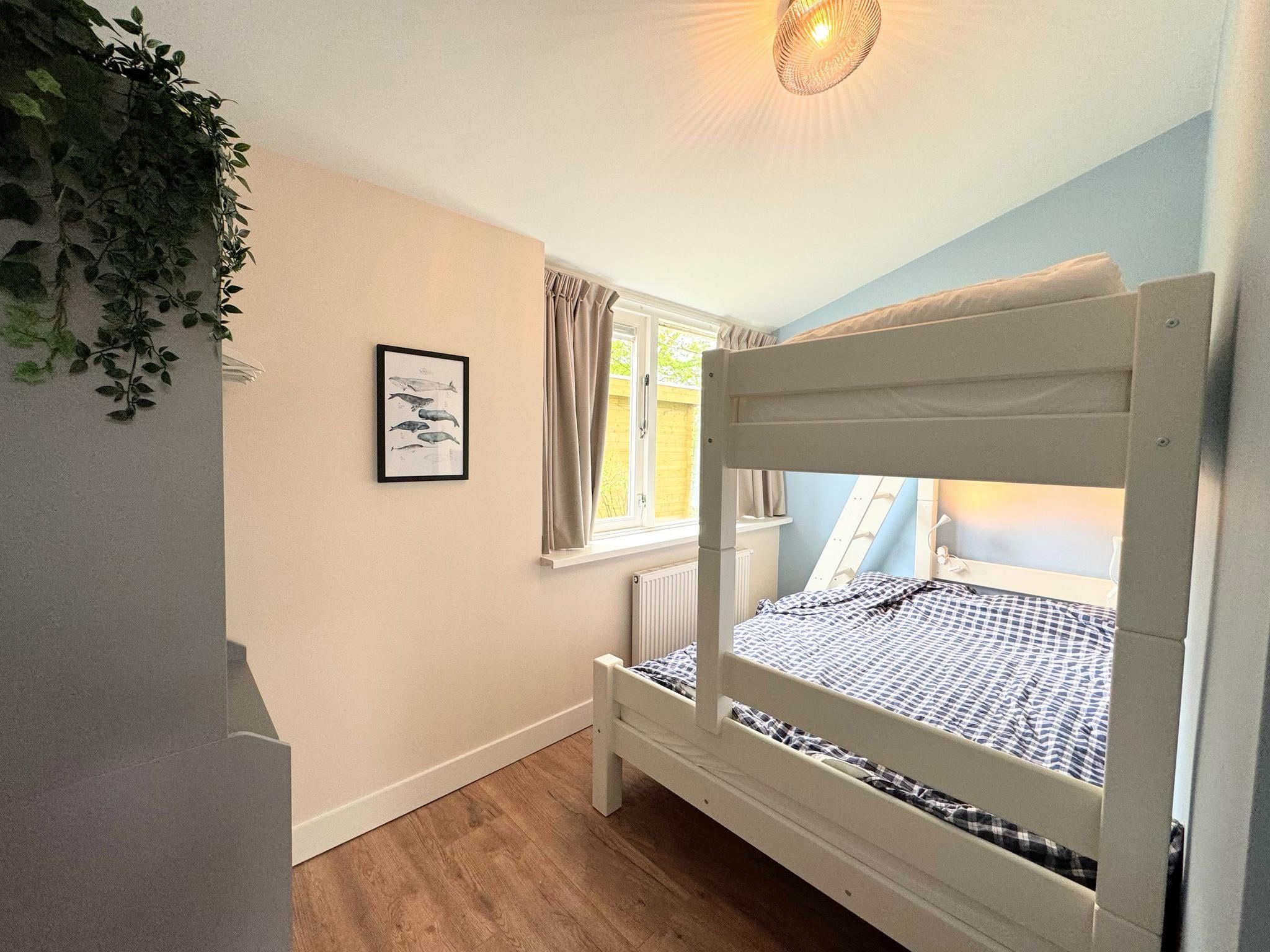 Een slaapkamer van Duinland 68 in Sint Maartenszee
