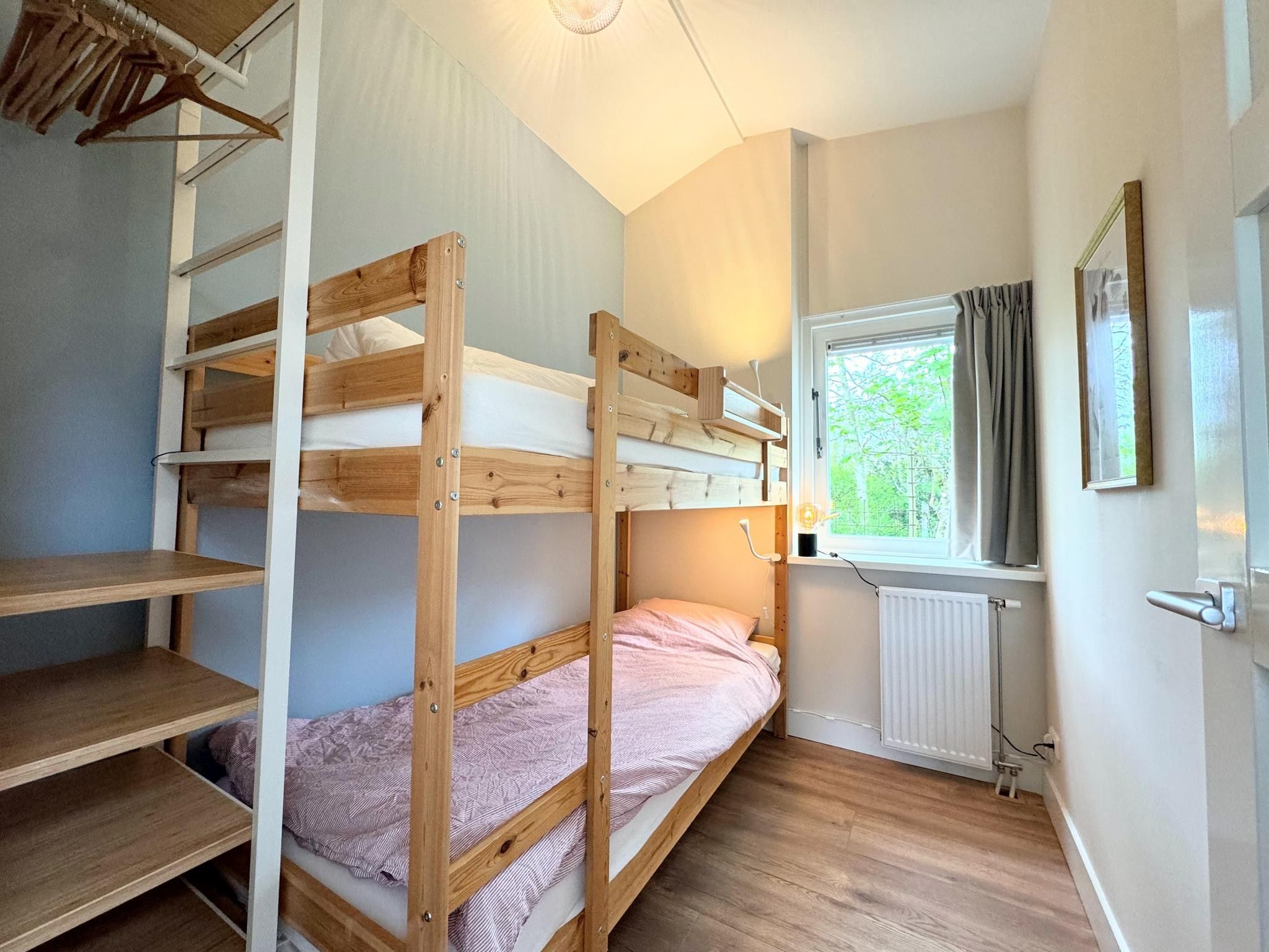 Een slaapkamer van Duinland 68 in Sint Maartenszee