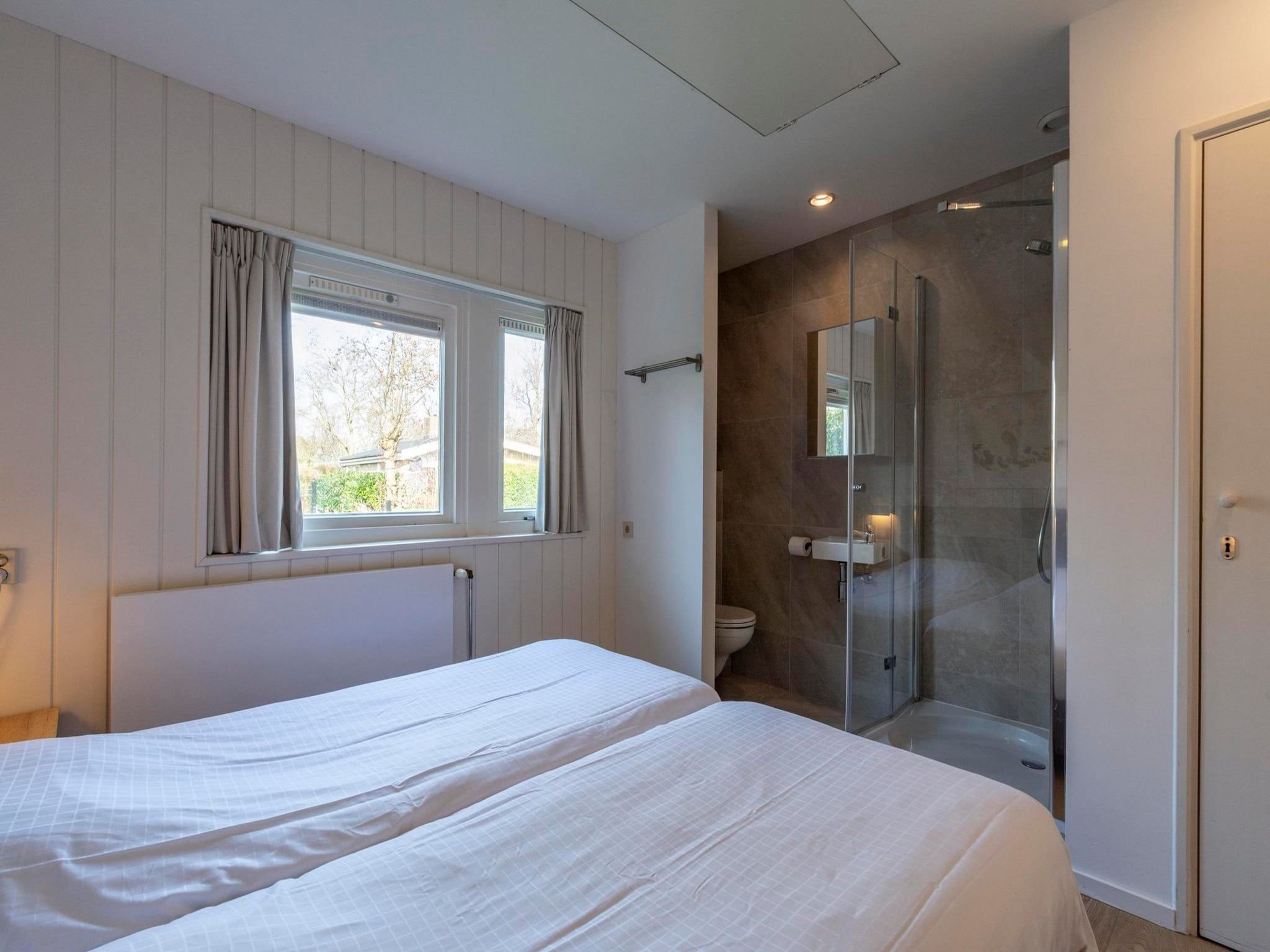 Een slaapkamer van Duinland 55 in Sint Maartenszee