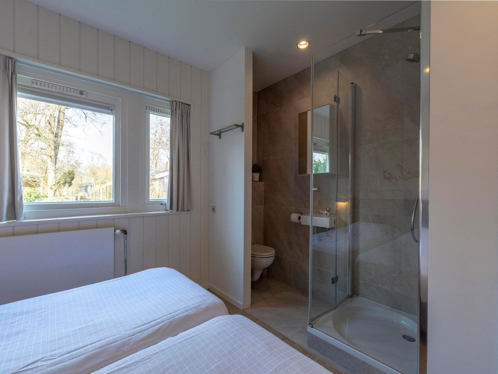 Een slaapkamer van Duinland 55 in Sint Maartenszee