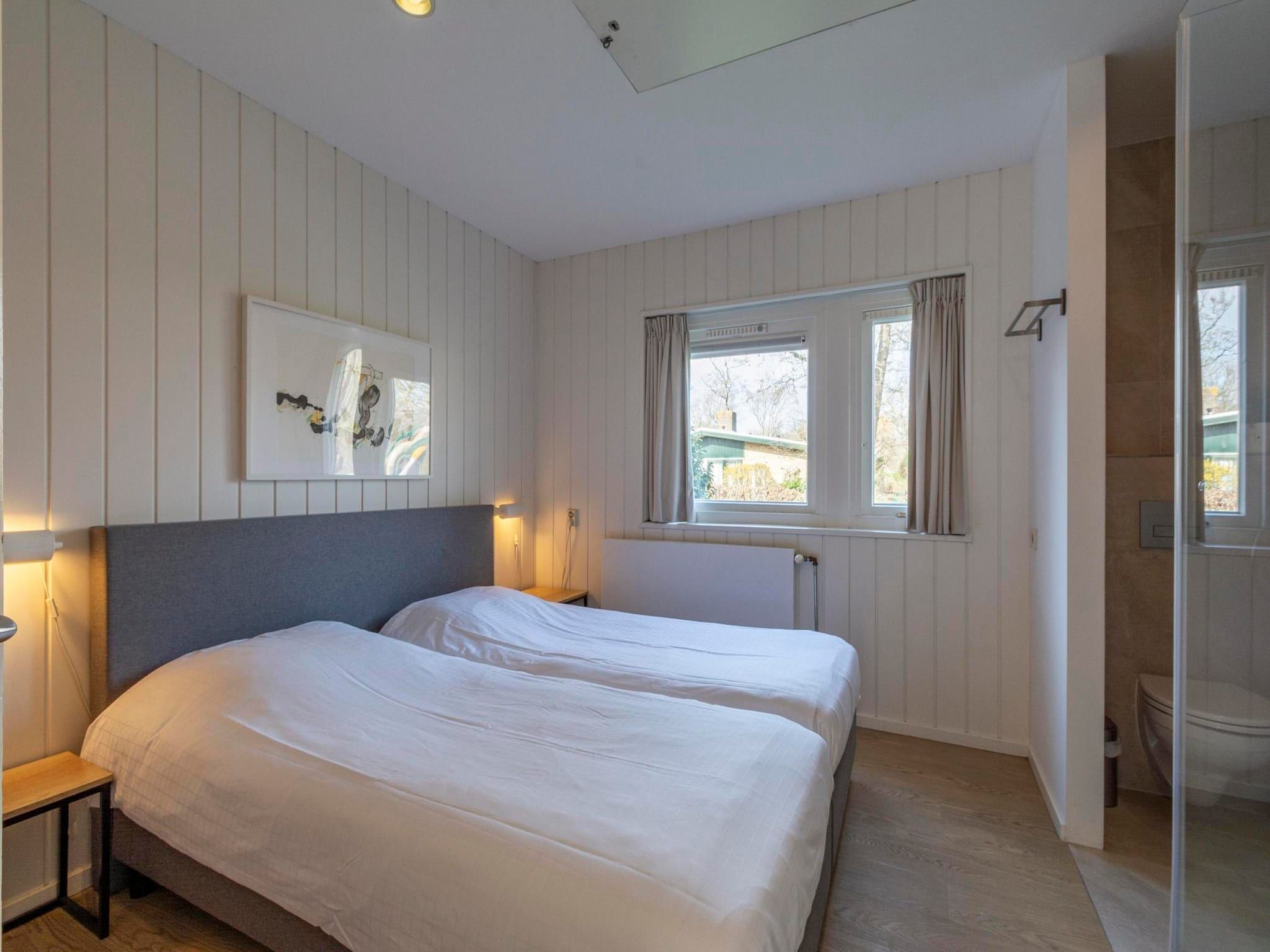 Een slaapkamer van Duinland 55 in Sint Maartenszee