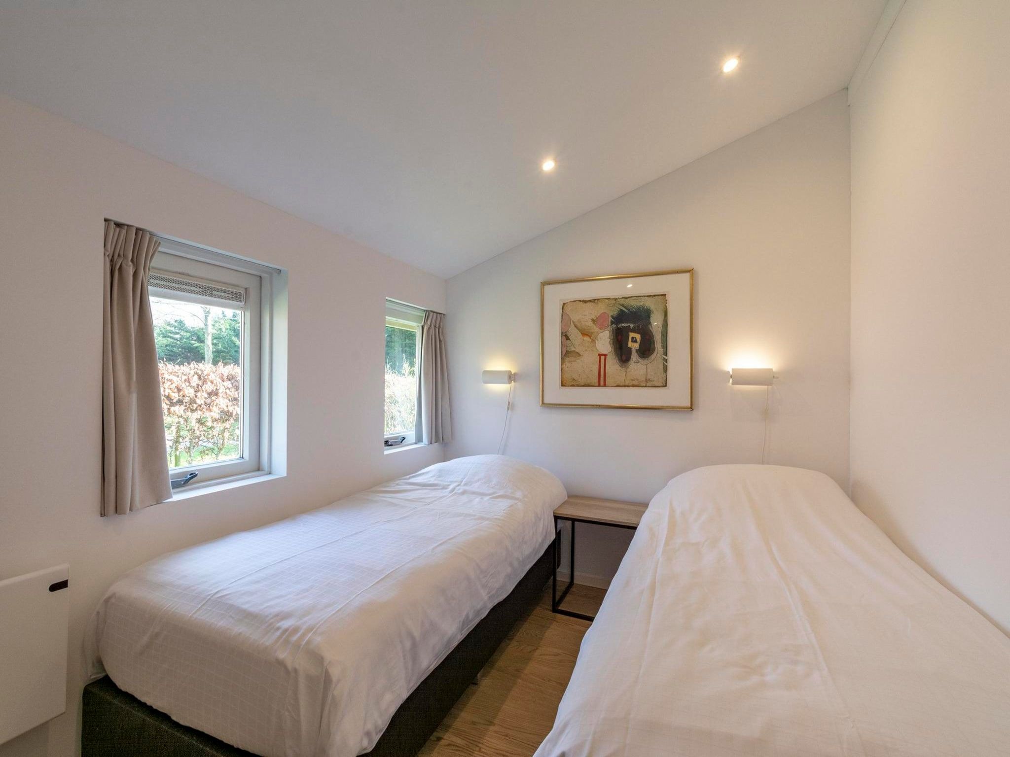 Een slaapkamer van Duinland 55 in Sint Maartenszee