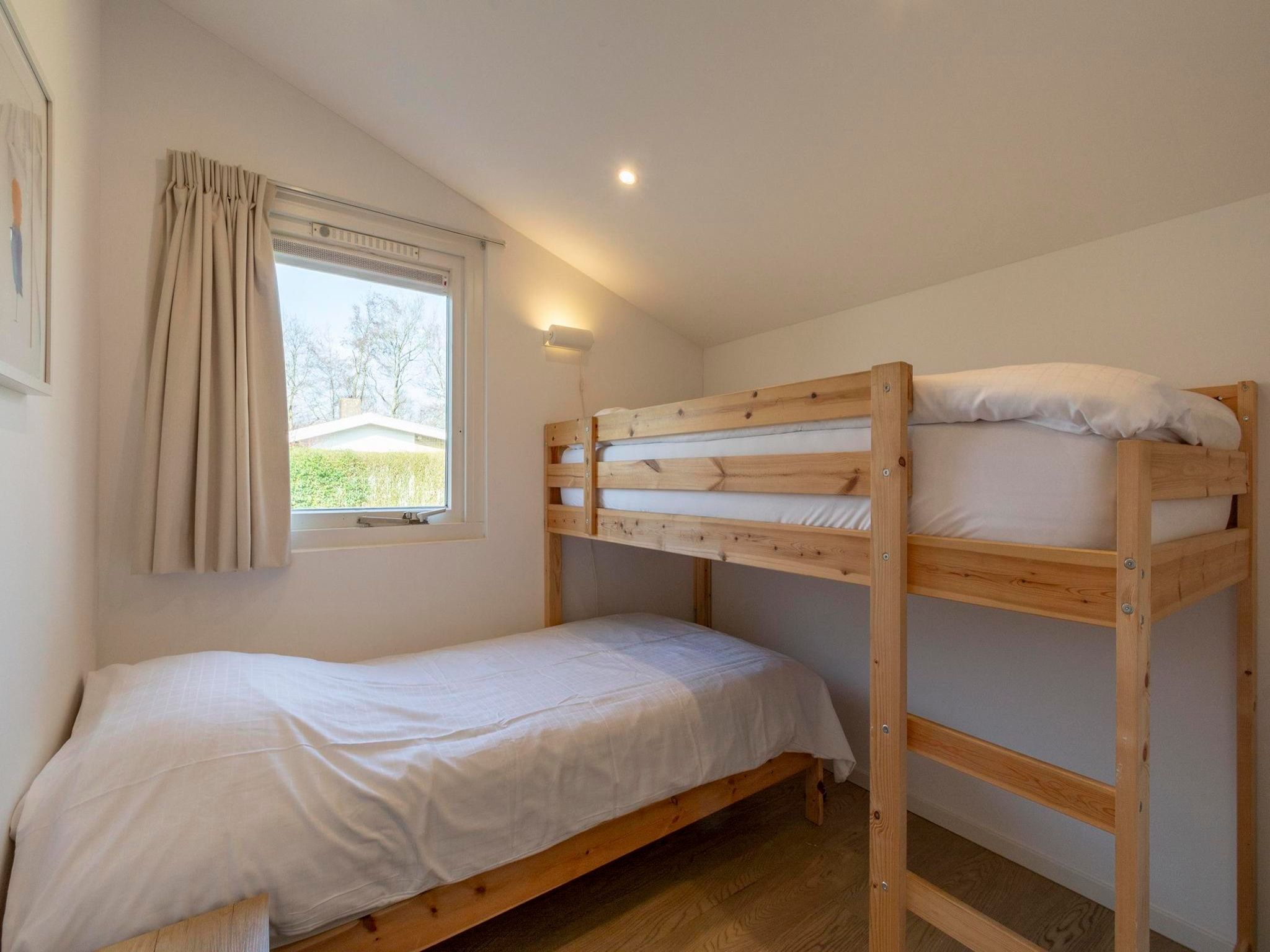Een slaapkamer van Duinland 55 in Sint Maartenszee