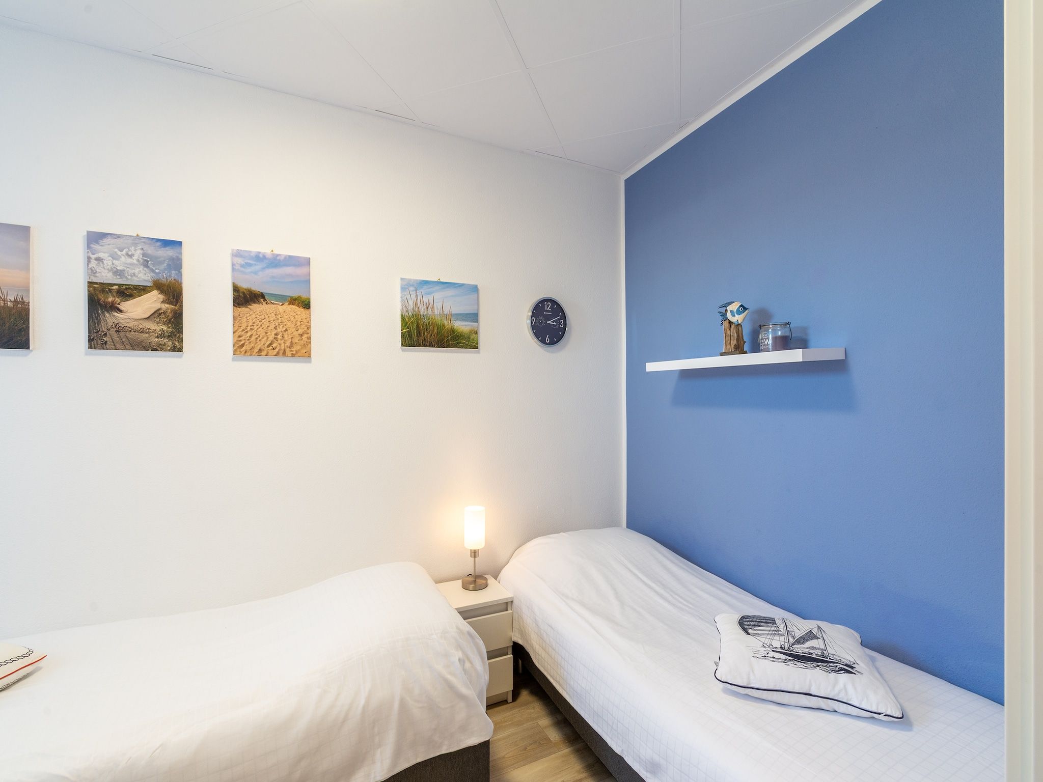 Een slaapkamer van Strandslag 103 in Julianadorp aan Zee