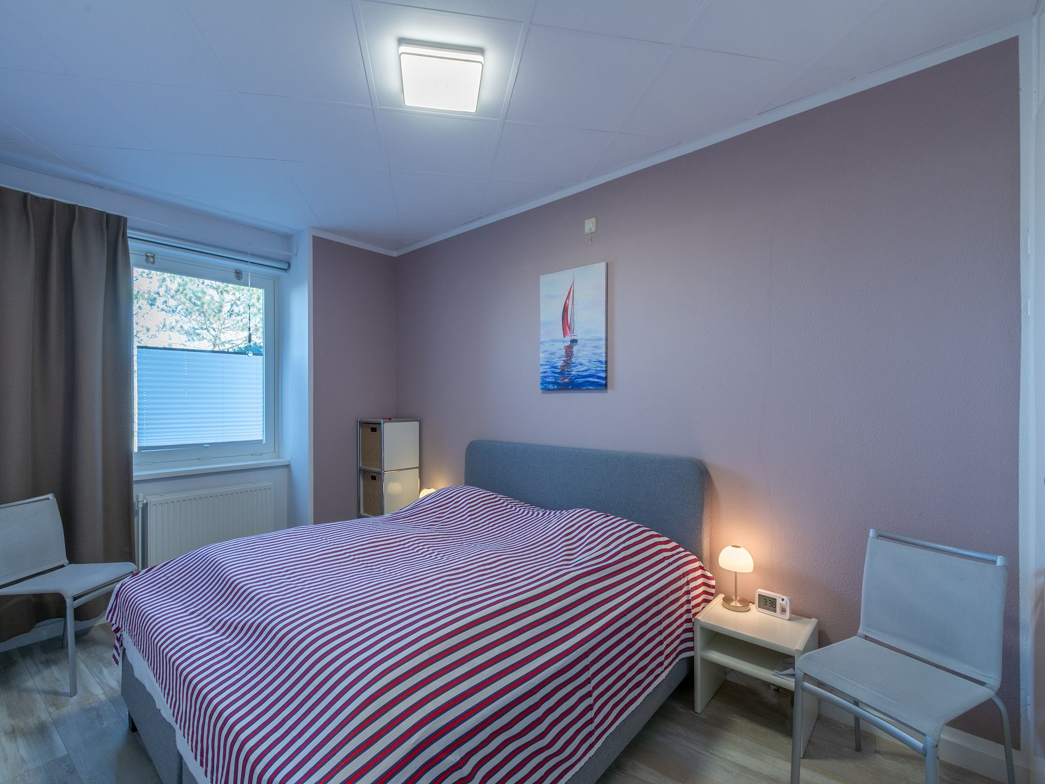 Een slaapkamer van Strandslag 103 in Julianadorp aan Zee