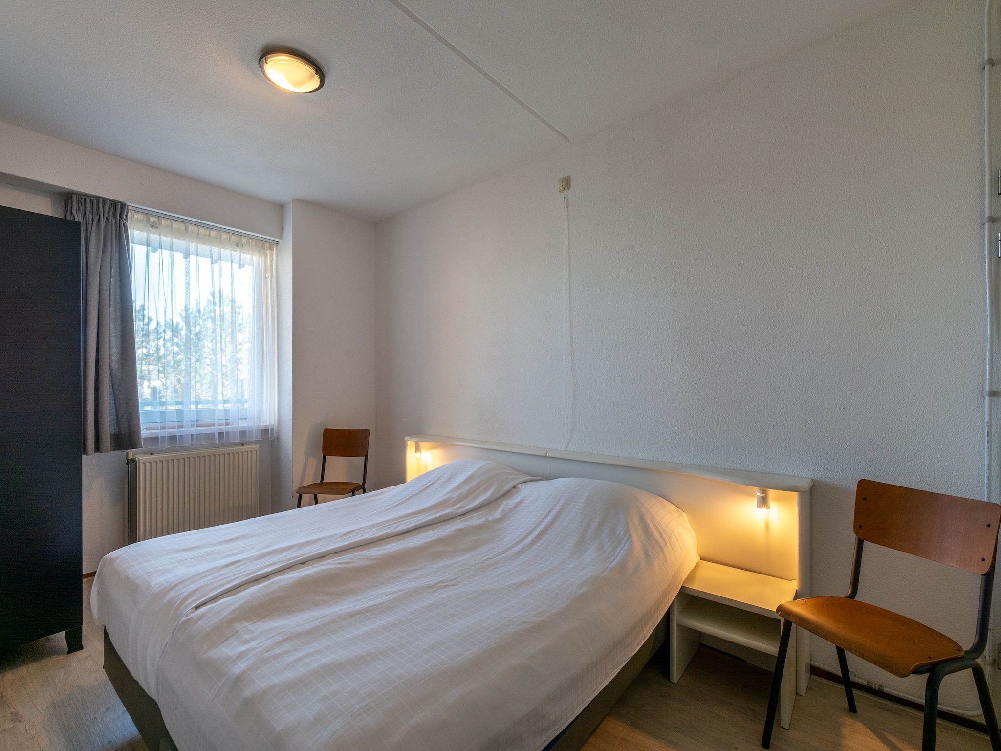Een slaapkamer van Strandslag 127 in Julianadorp aan Zee