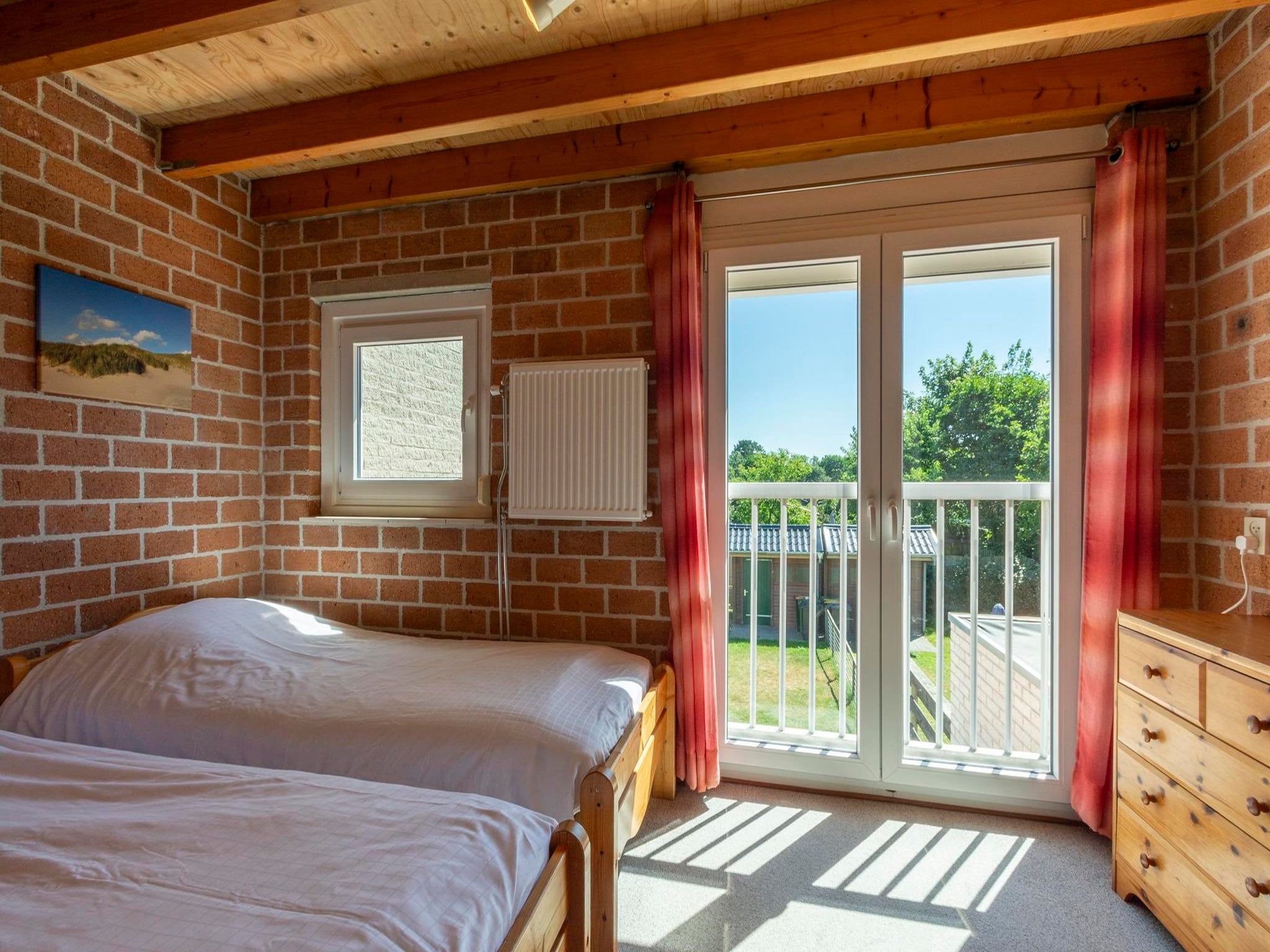 Een slaapkamer van Abbestederweg 24A in Callantsoog