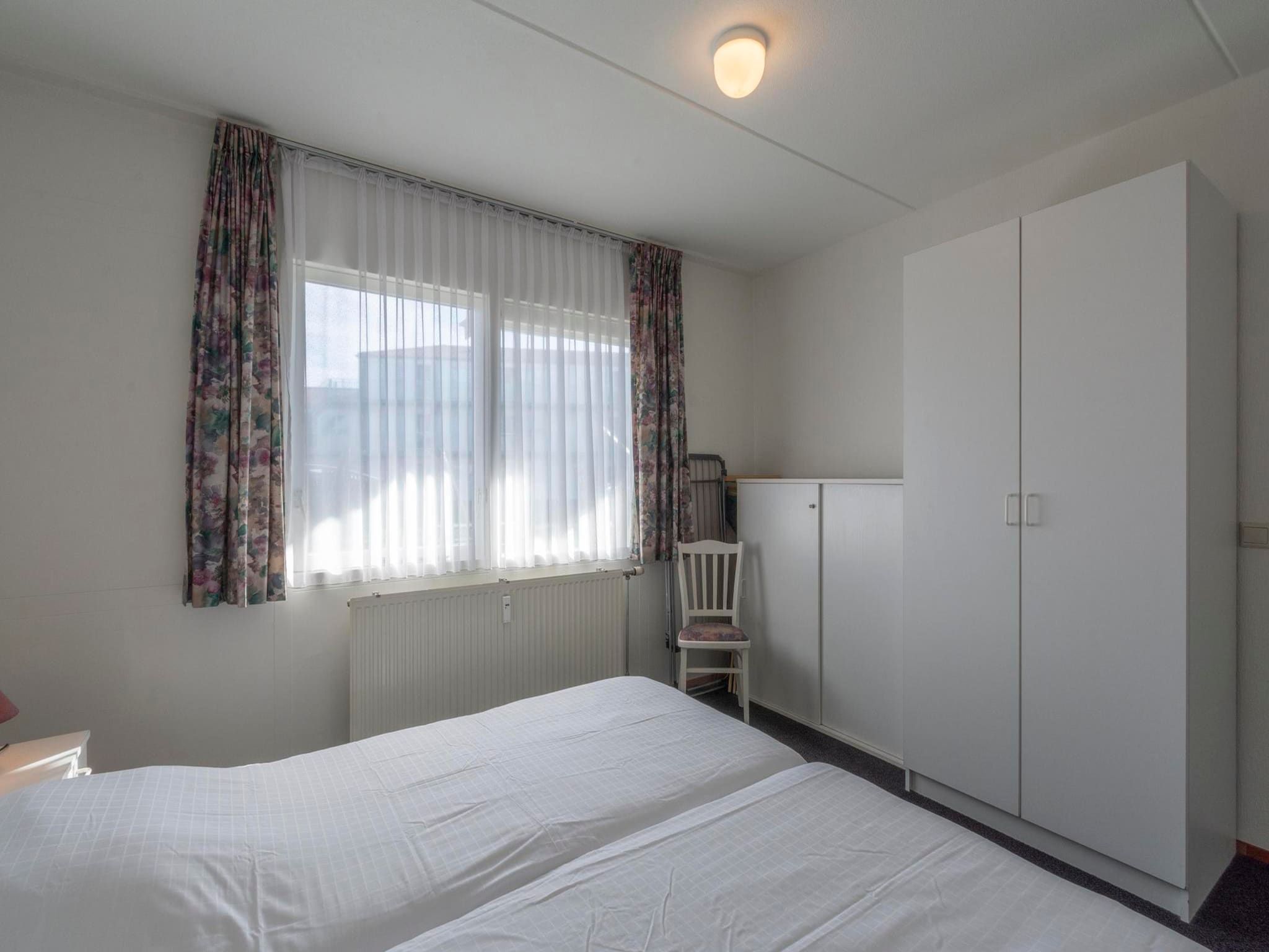 Een slaapkamer van Beach Appartement 05 in Callantsoog