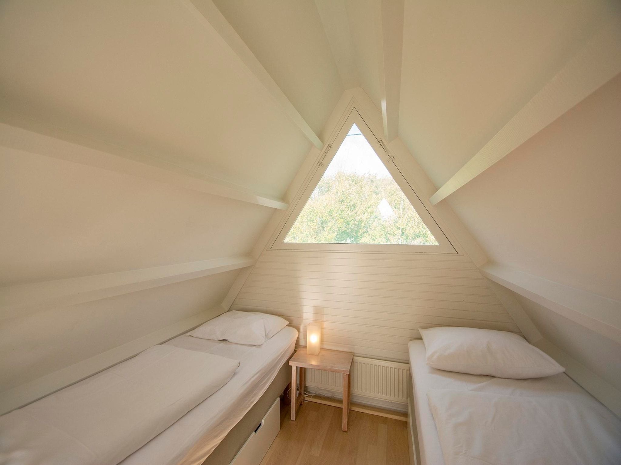 Een slaapkamer van Sandepark 66 in Callantsoog