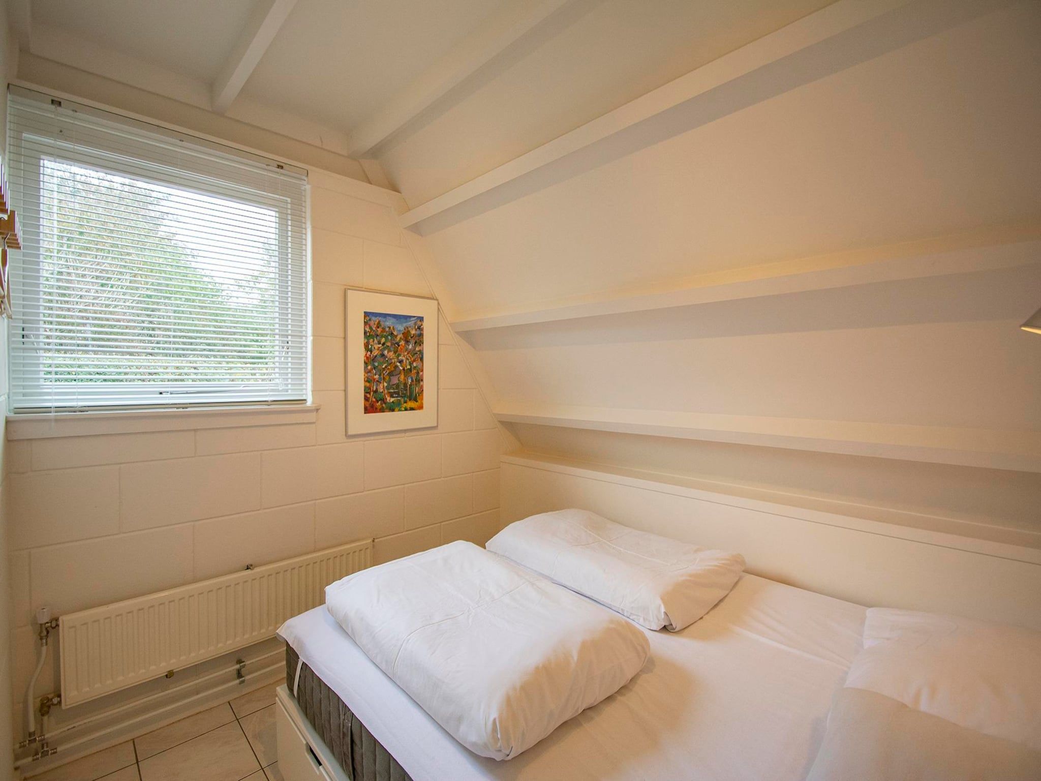Een slaapkamer van Sandepark 66 in Callantsoog