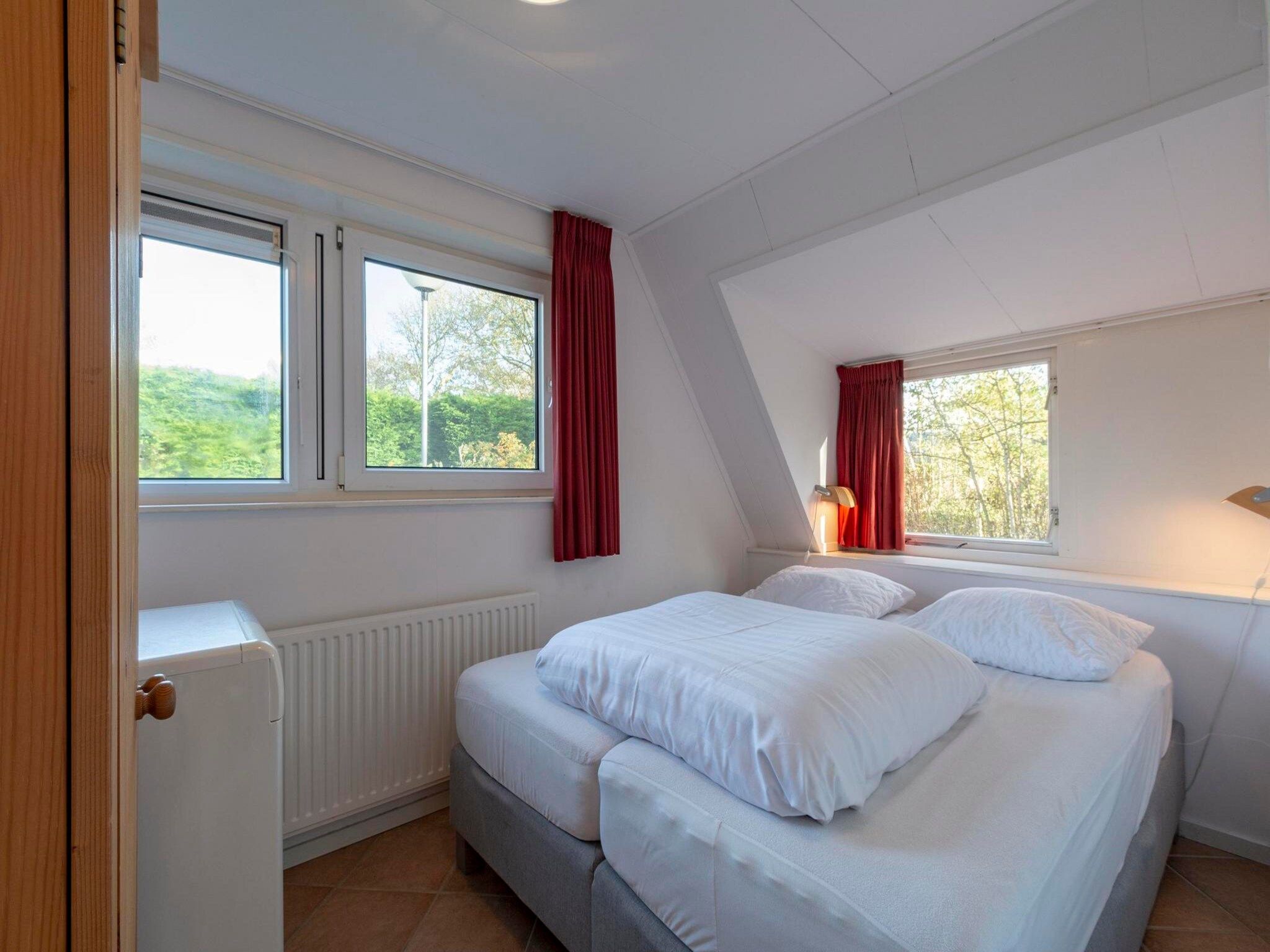 Een slaapkamer van Sandepark 93 in Callantsoog