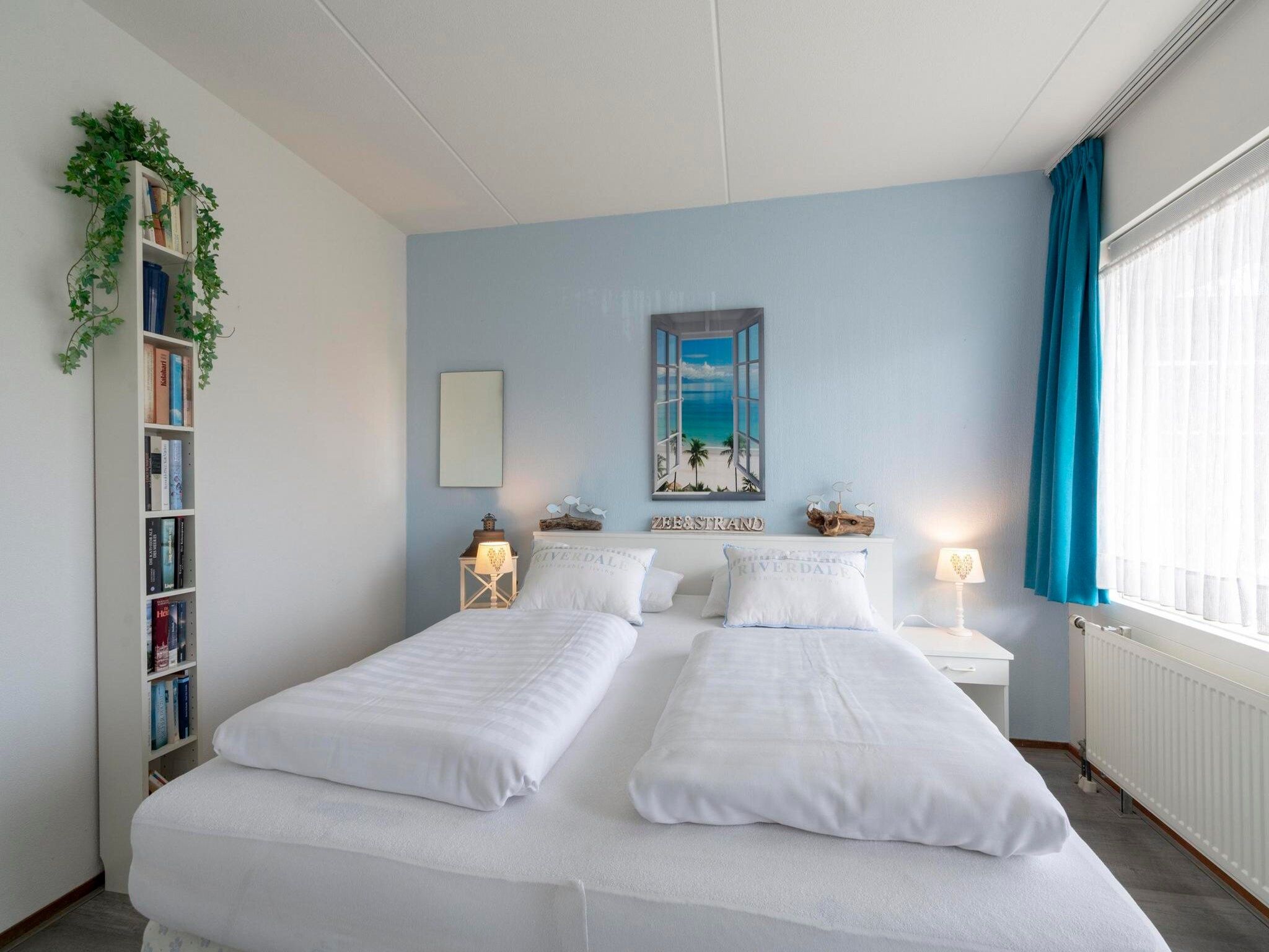 Een slaapkamer van Beach Appartement 11 in Callantsoog