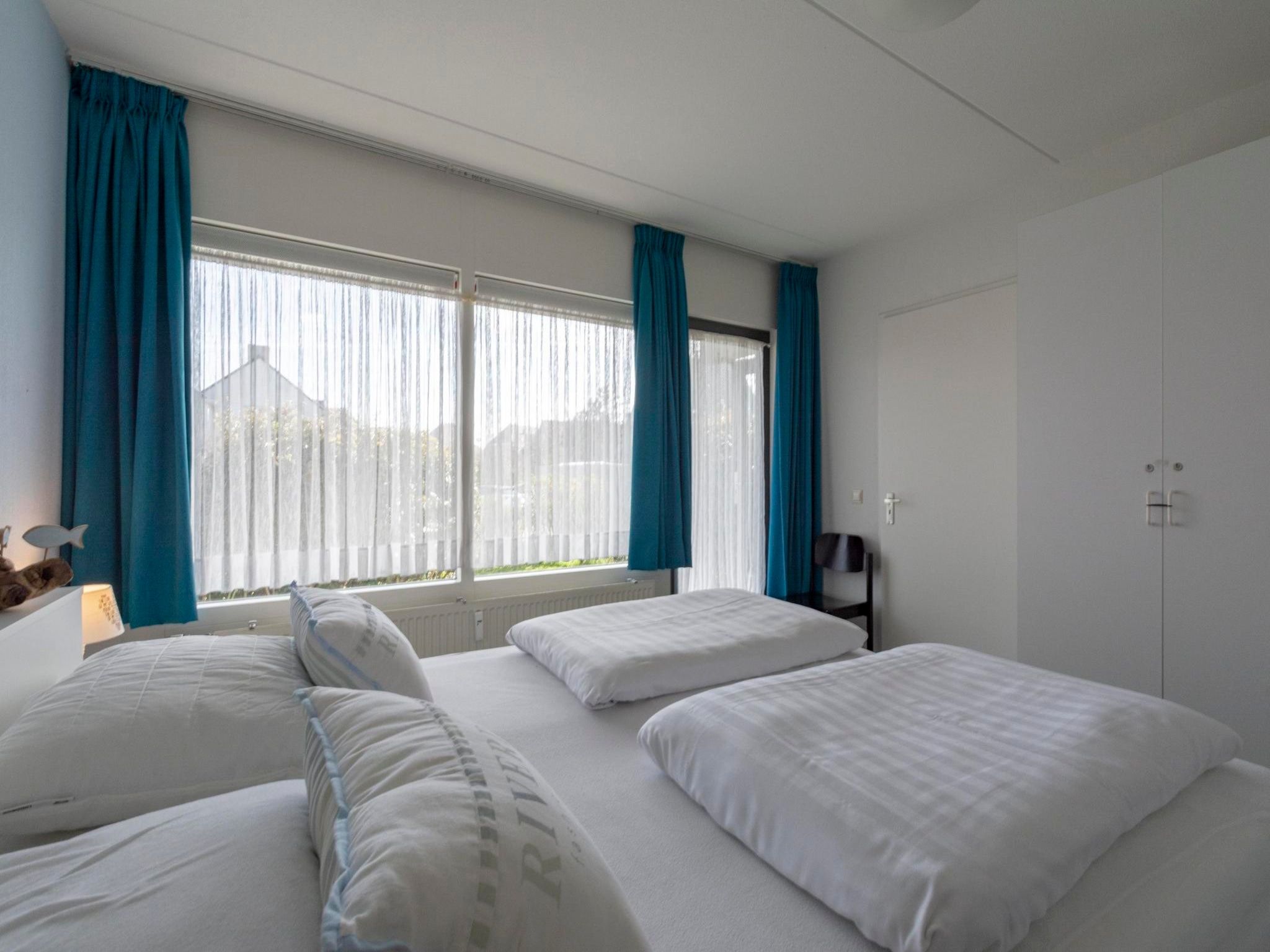 Een slaapkamer van Beach Appartement 11 in Callantsoog