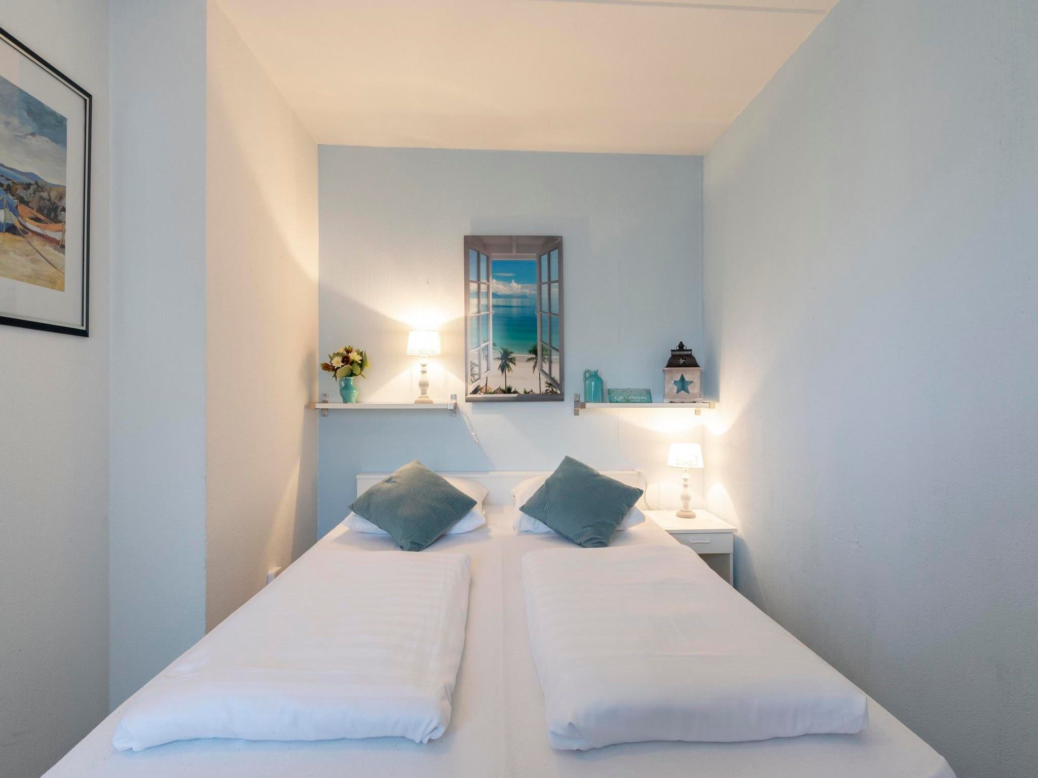 Een slaapkamer van Beach Appartement 11 in Callantsoog