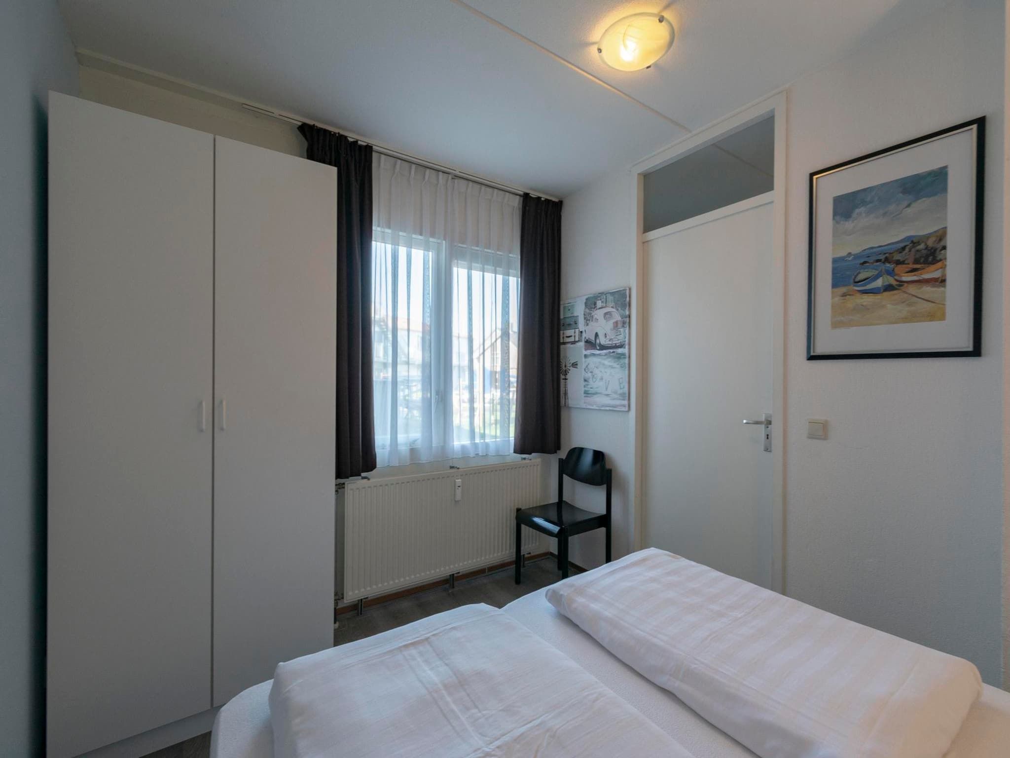 Een slaapkamer van Beach Appartement 11 in Callantsoog