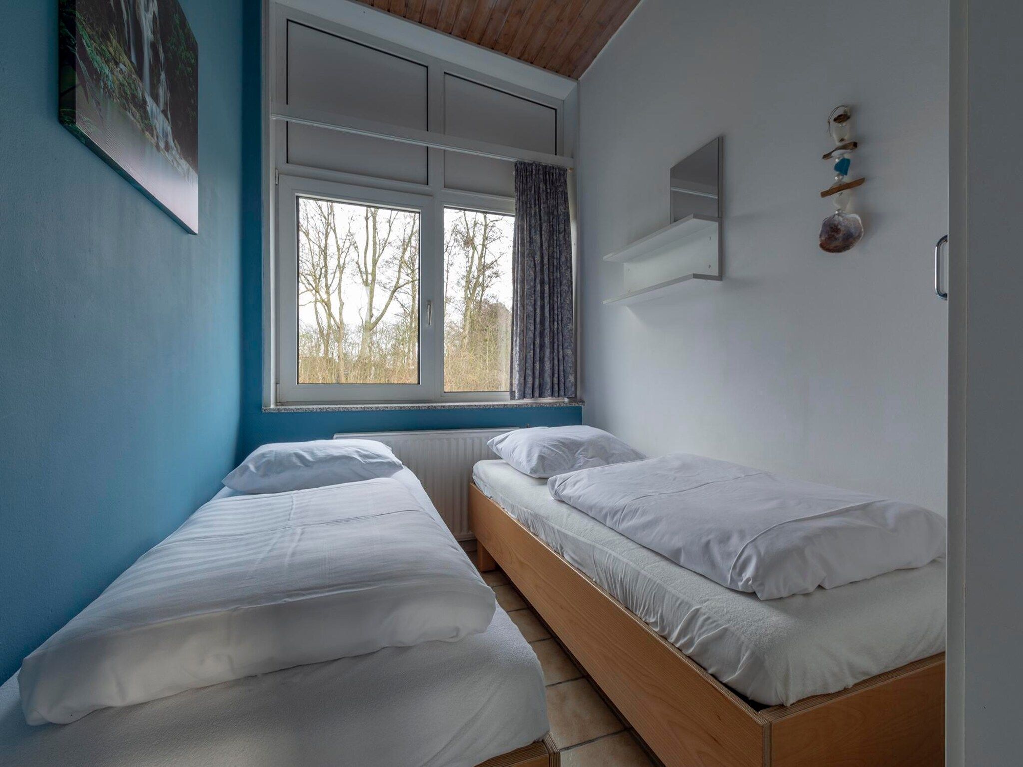 Een slaapkamer van Duinland XL in Sint Maartenszee