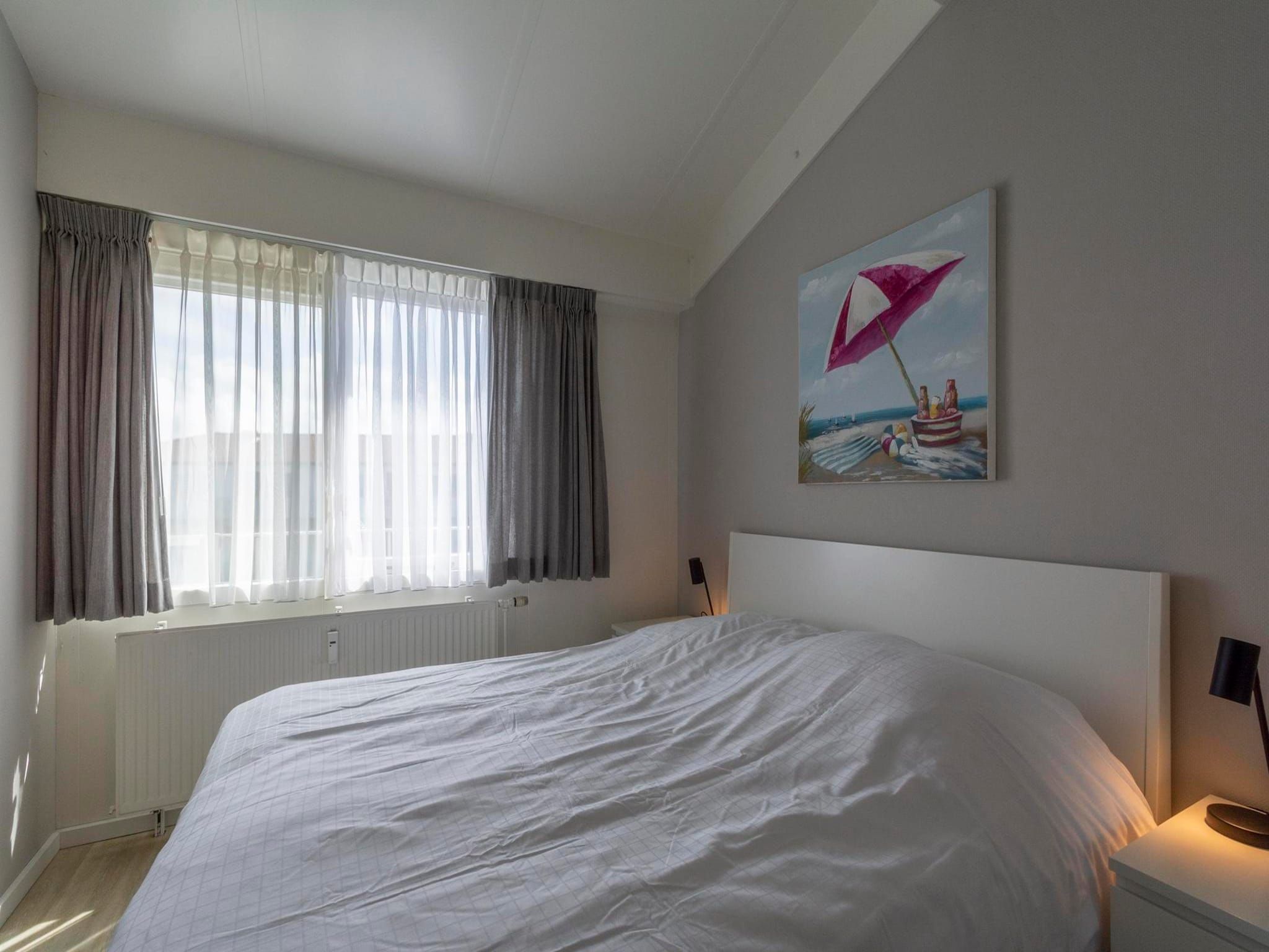 Een slaapkamer van Beach Appartement 35 in Callantsoog