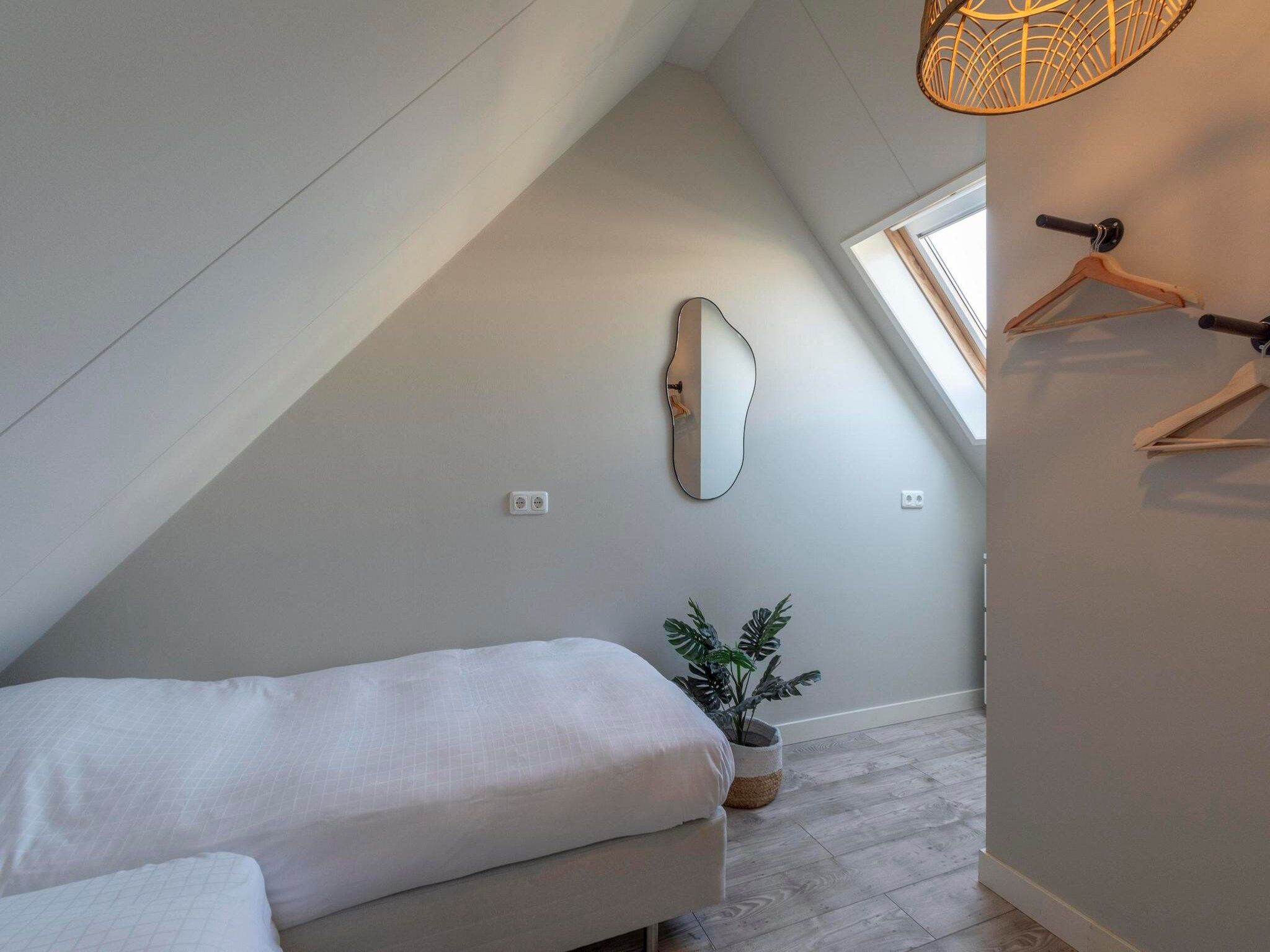Een slaapkamer van Duinroosweg 83 in Callantsoog