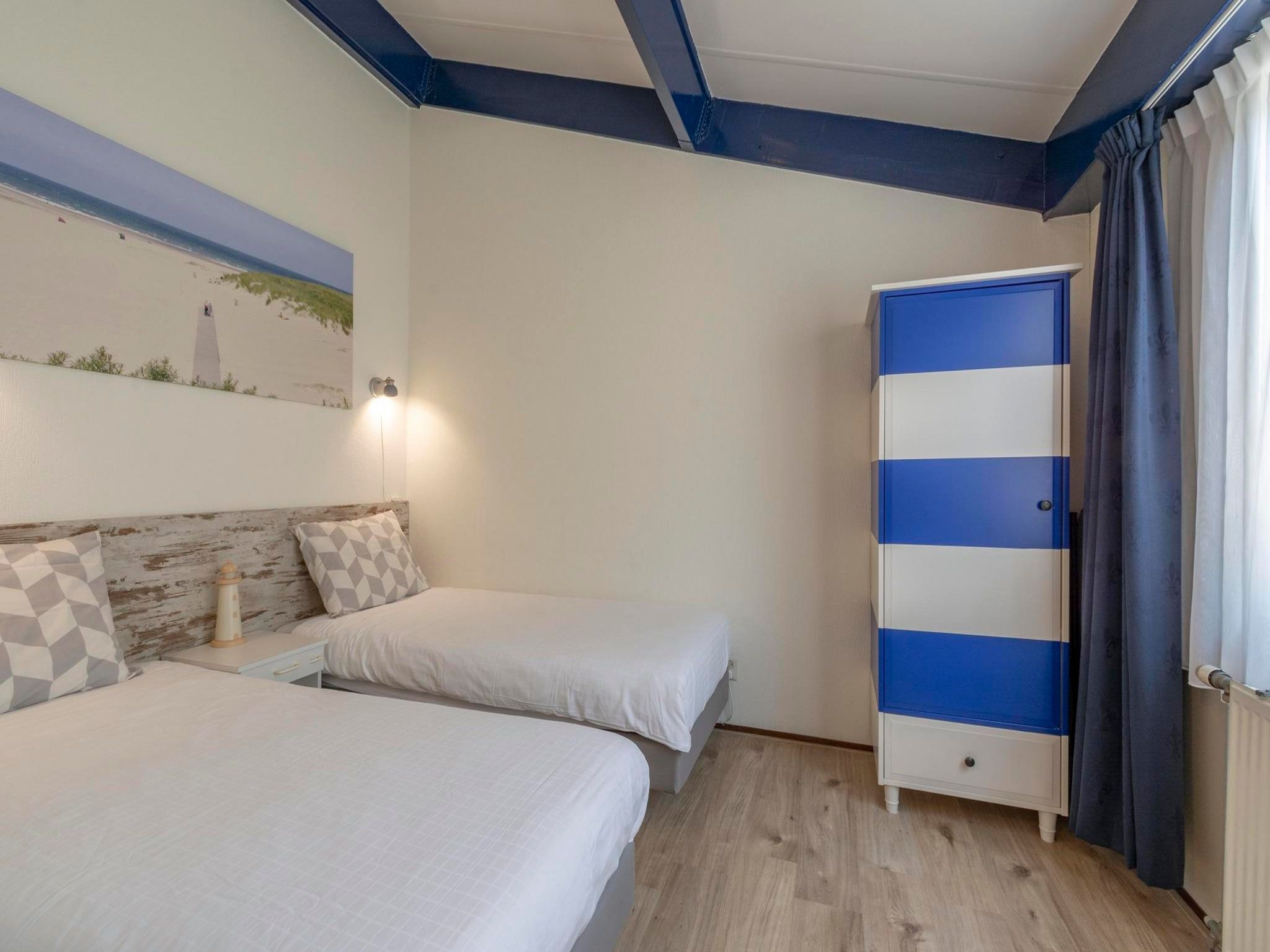 Een slaapkamer van Beach Appartement 41 in Callantsoog