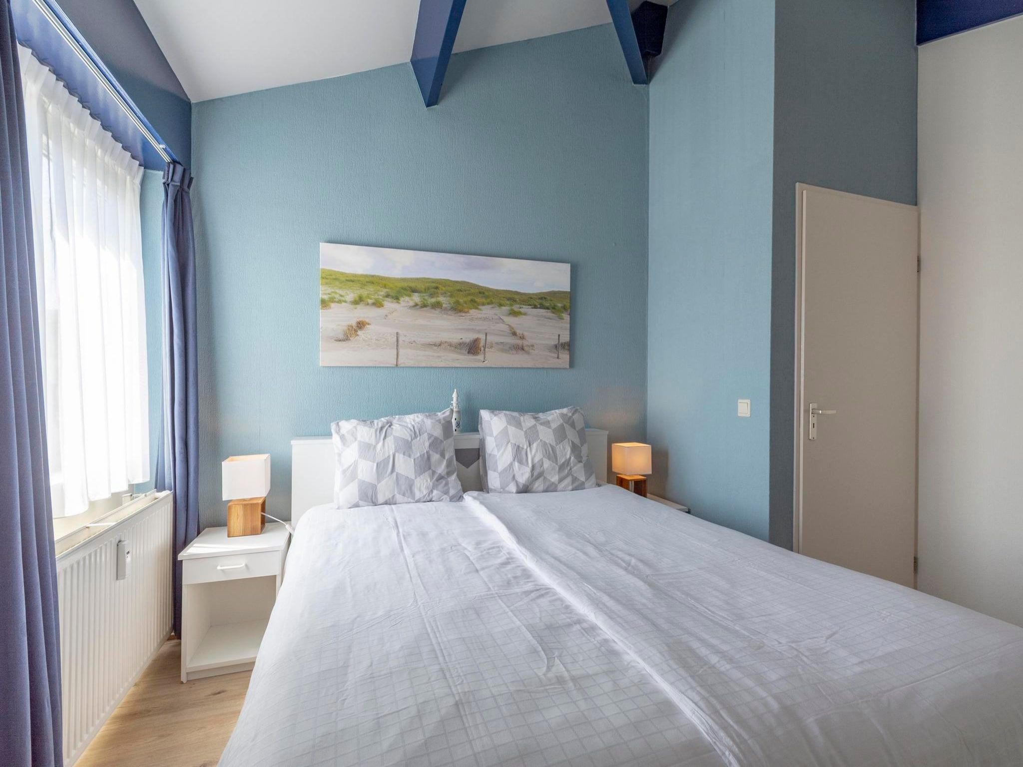 Een slaapkamer van Beach Appartement 41 in Callantsoog