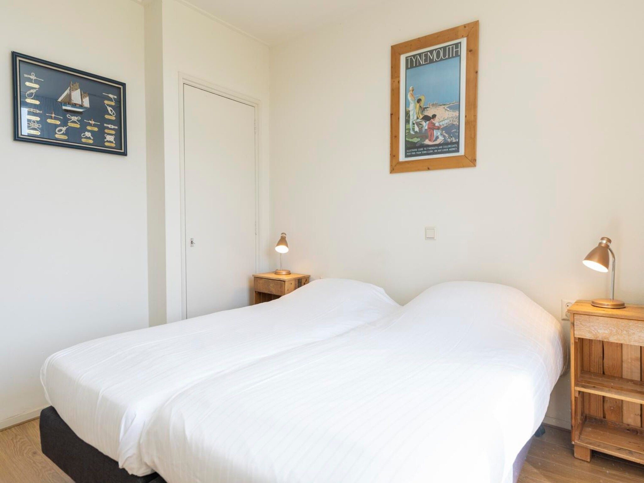 Een slaapkamer van Strandhuys Mossel in De Koog