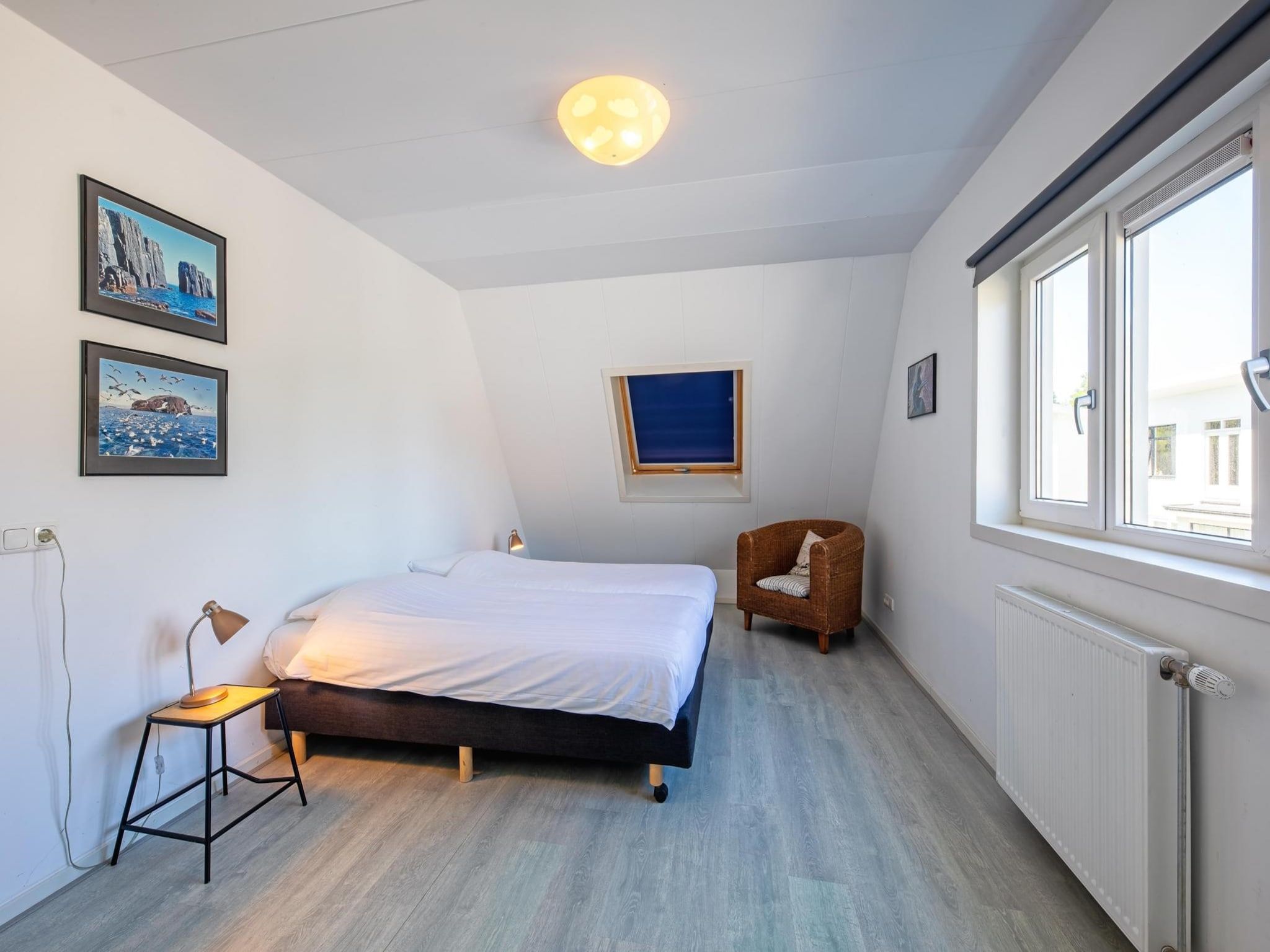 Een slaapkamer van Strandhuys Oester in De Koog