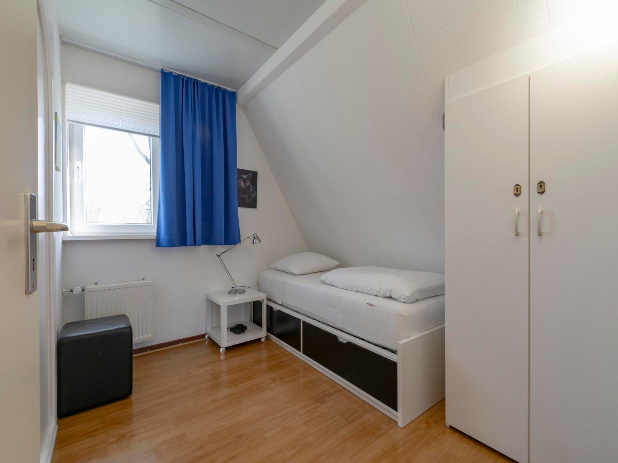 Een slaapkamer van Campanula 52 in Sint Maartenszee