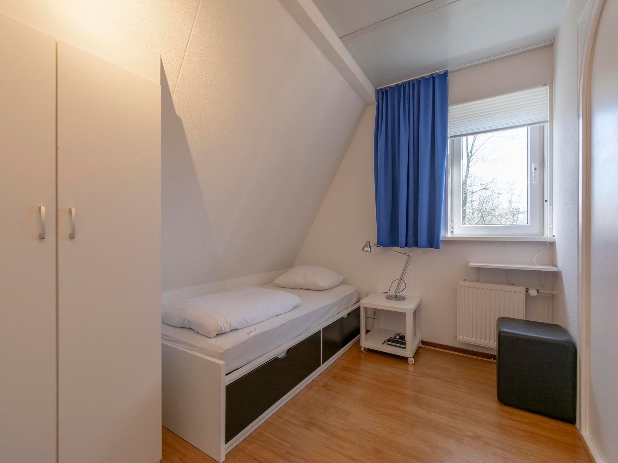 Een slaapkamer van Campanula 52 in Sint Maartenszee