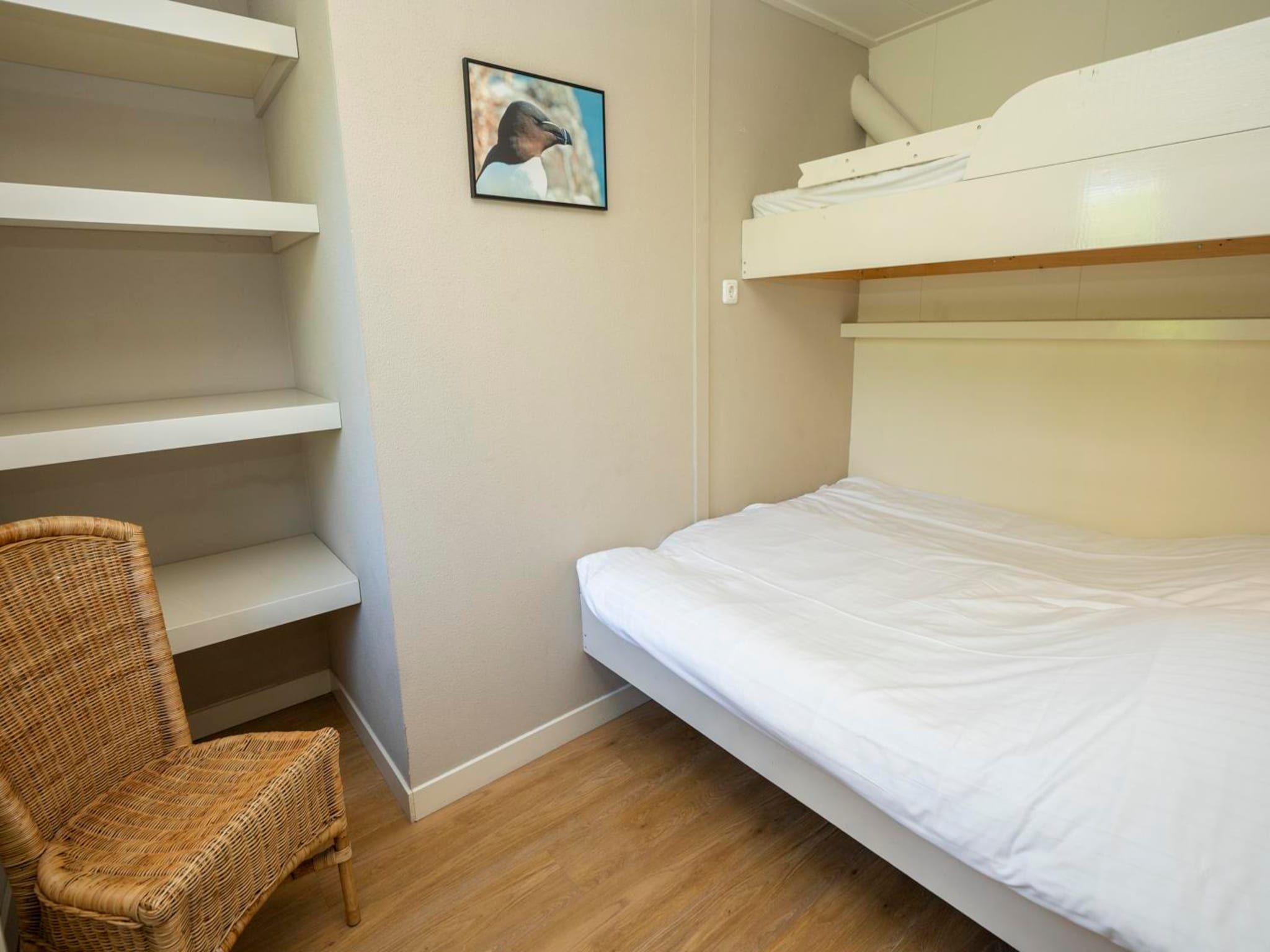 Een slaapkamer van Strandhuys Schelp in De Koog