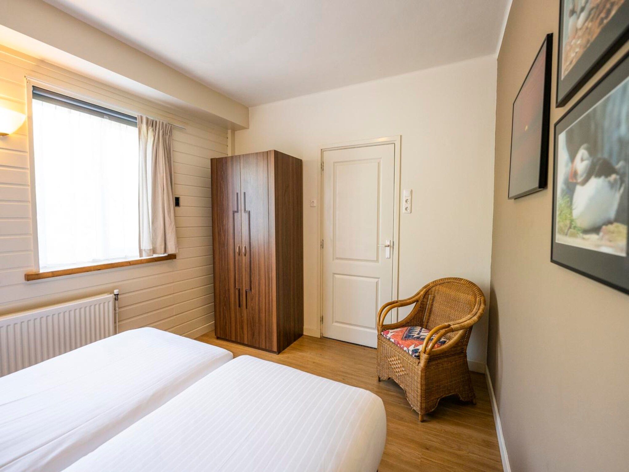 Een slaapkamer van Strandhuys Schelp in De Koog