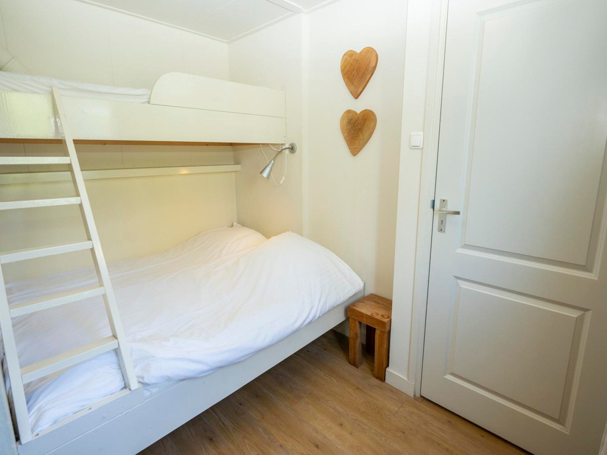 Een slaapkamer van Strandhuys Schelp in De Koog