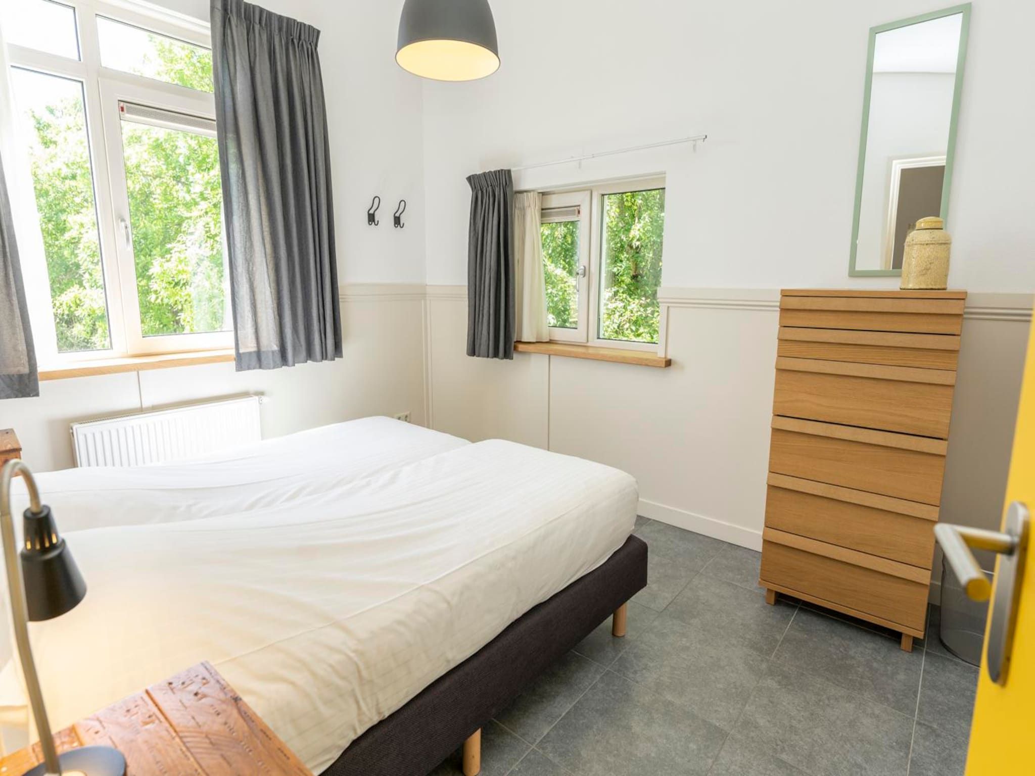 Een slaapkamer van Strandhuys Wulk in De Koog