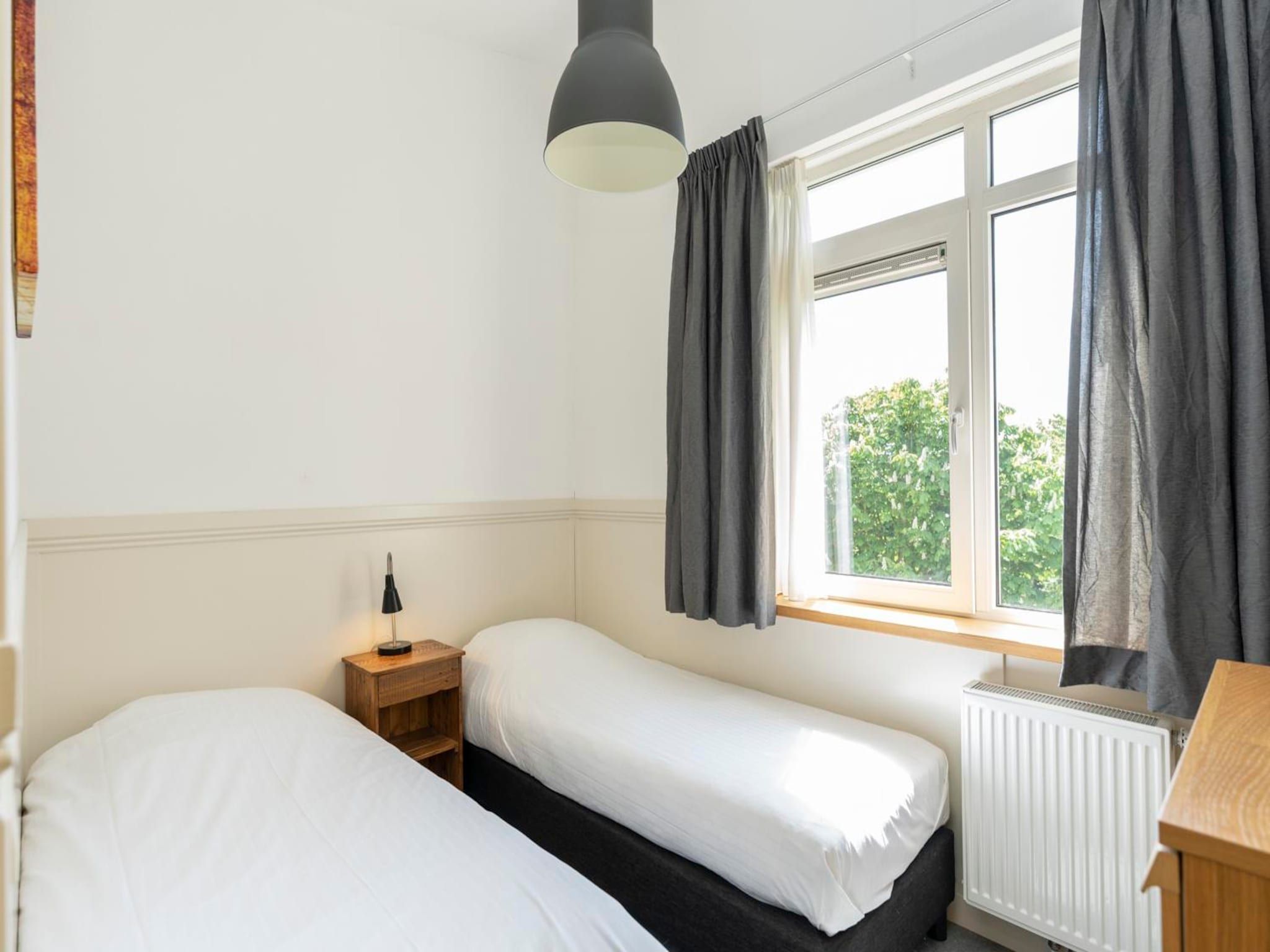 Een slaapkamer van Strandhuys Wulk in De Koog